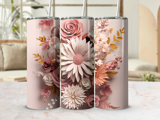 Pink floral pattern on three stainless steel tumblers with straws.