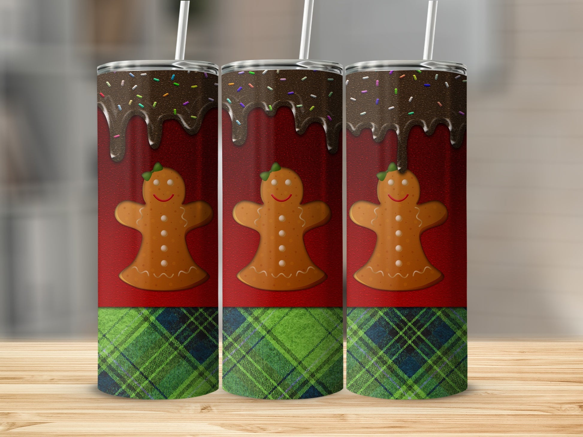 Three gingerbread men with chocolate and sprinkles on a red and plaid background.