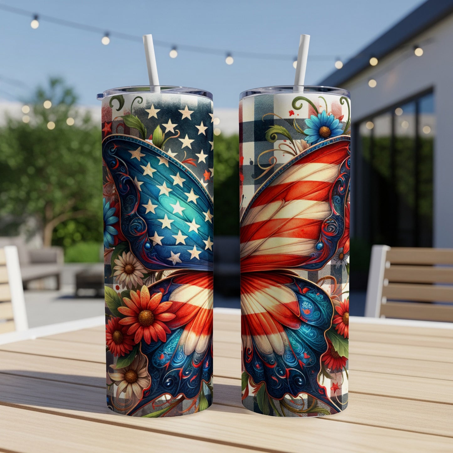 Two tumblers with American flag butterfly wings design on outdoor table.