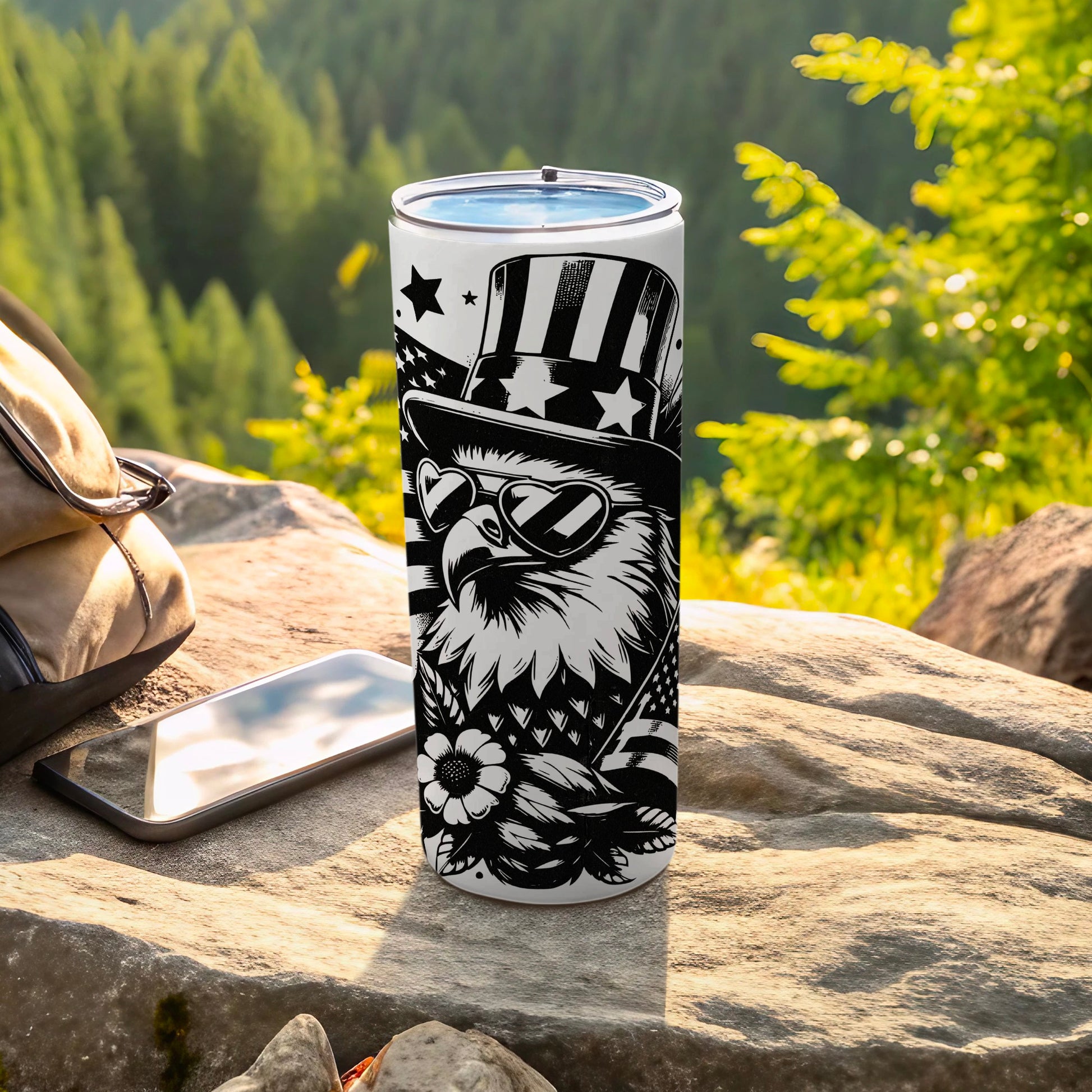 Eagle in patriotic hat and sunglasses on a tumbler.