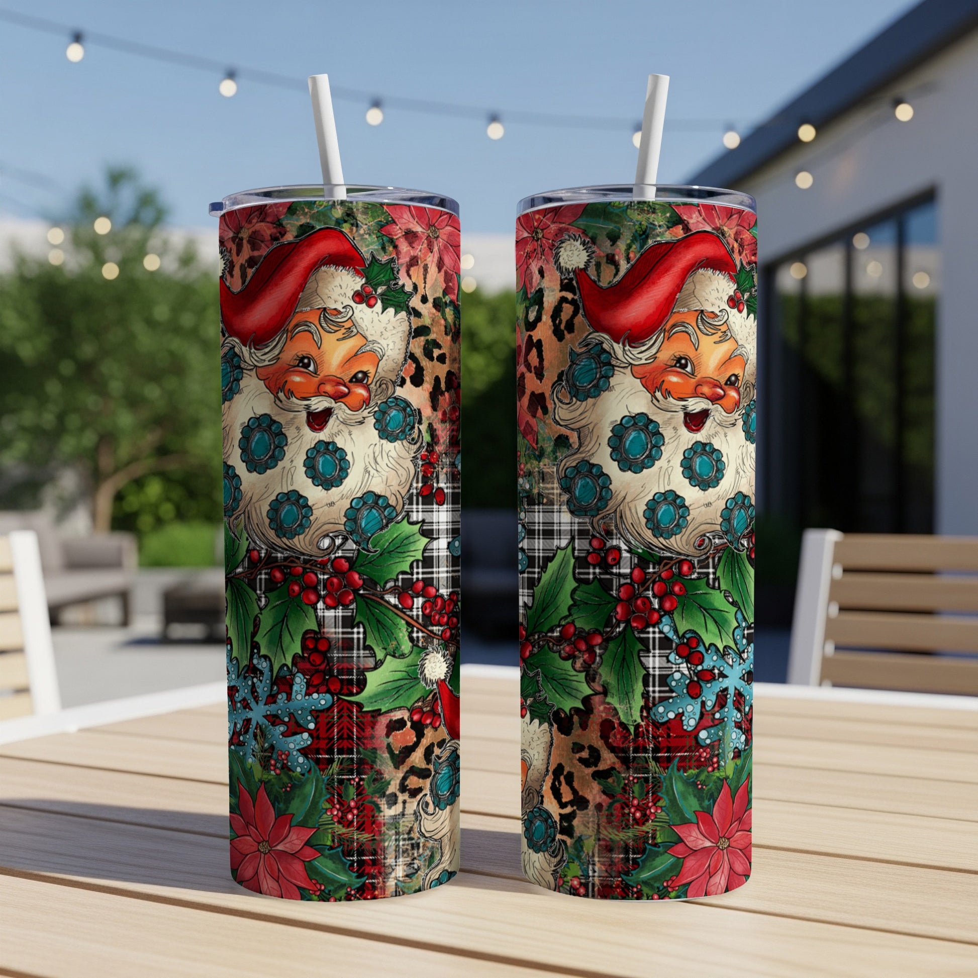 Two Santa Claus tumblers with leopard print and plaid patterns on a table.