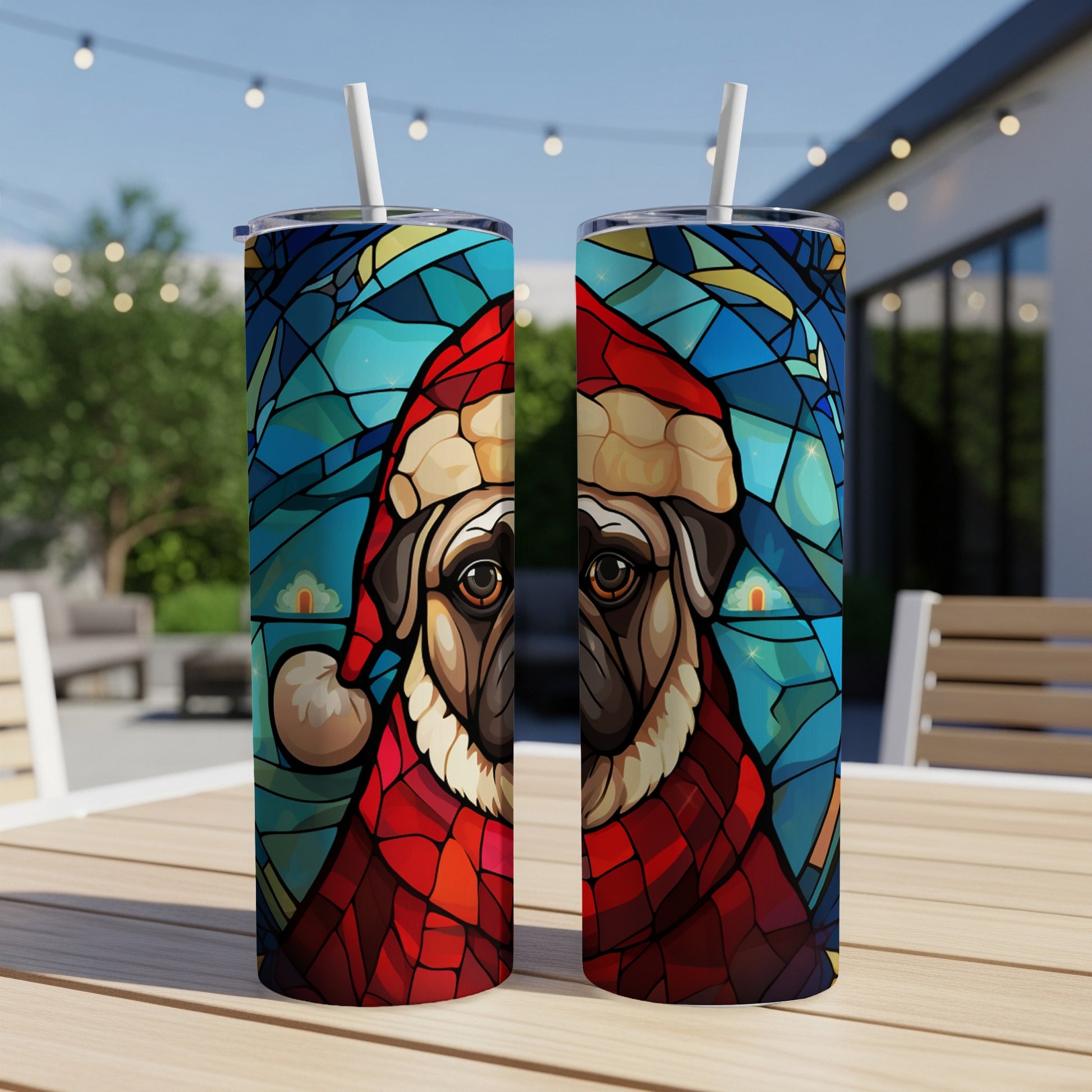 Two cylindrical tumblers featuring a stained-glass pug wearing a Santa hat.