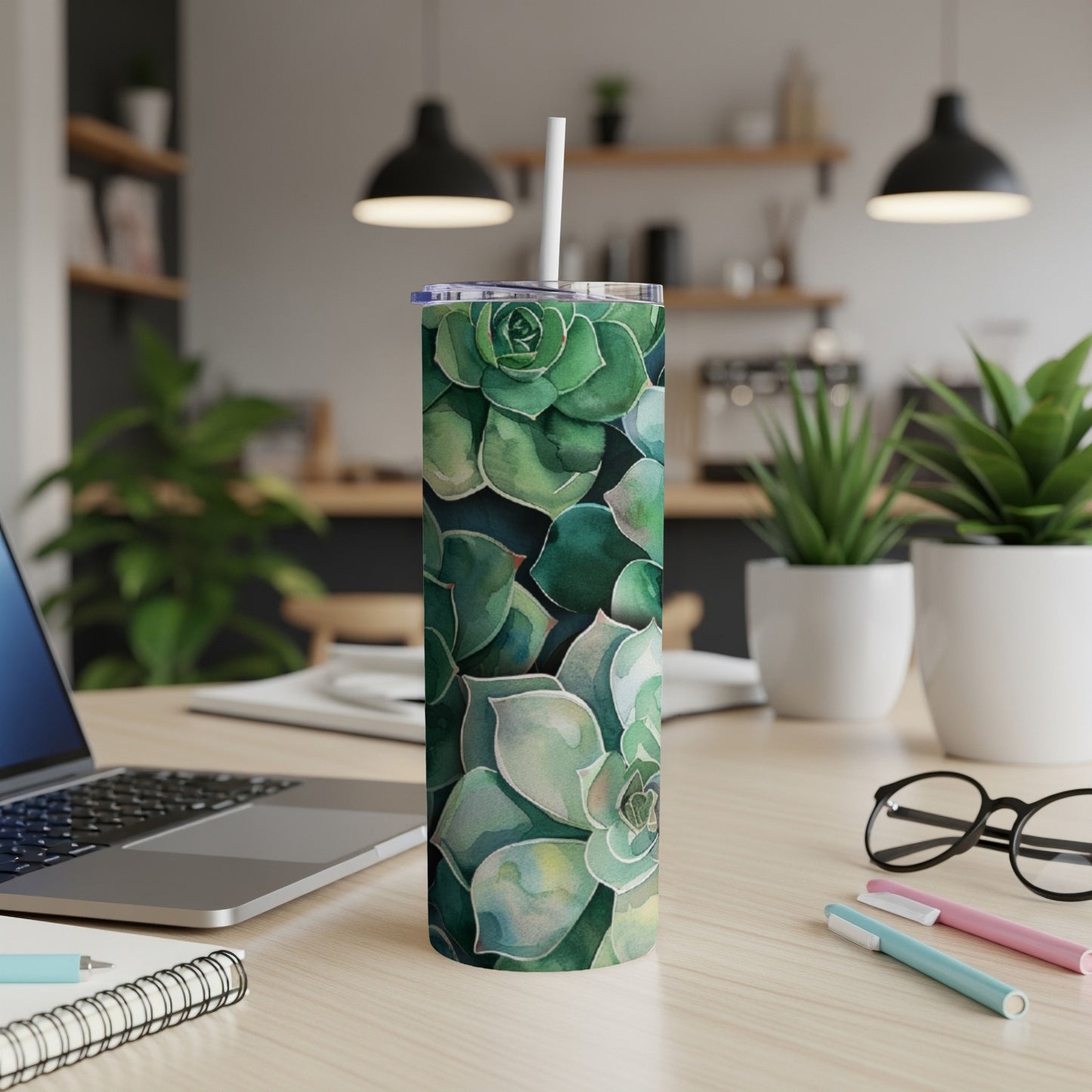 Green succulent plants pattern on a white tumbler with a straw.