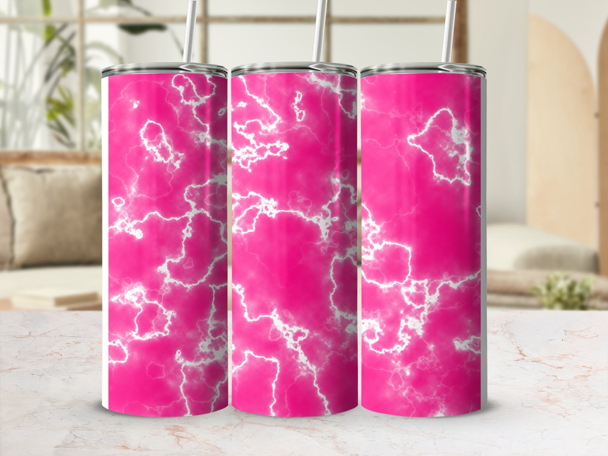 Pink marbled tumbler with white lightning bolt pattern and straw.