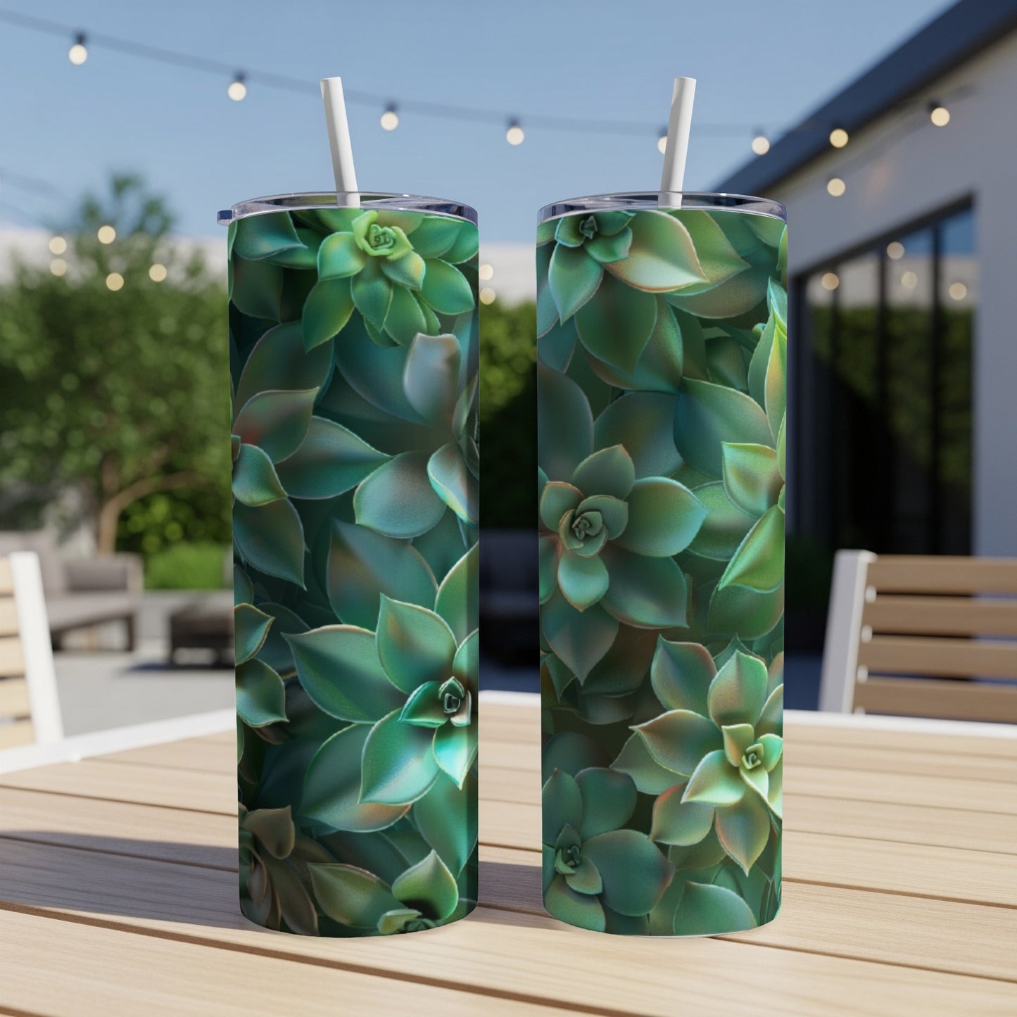 Two tumblers with succulent plant pattern on a table outdoors.
