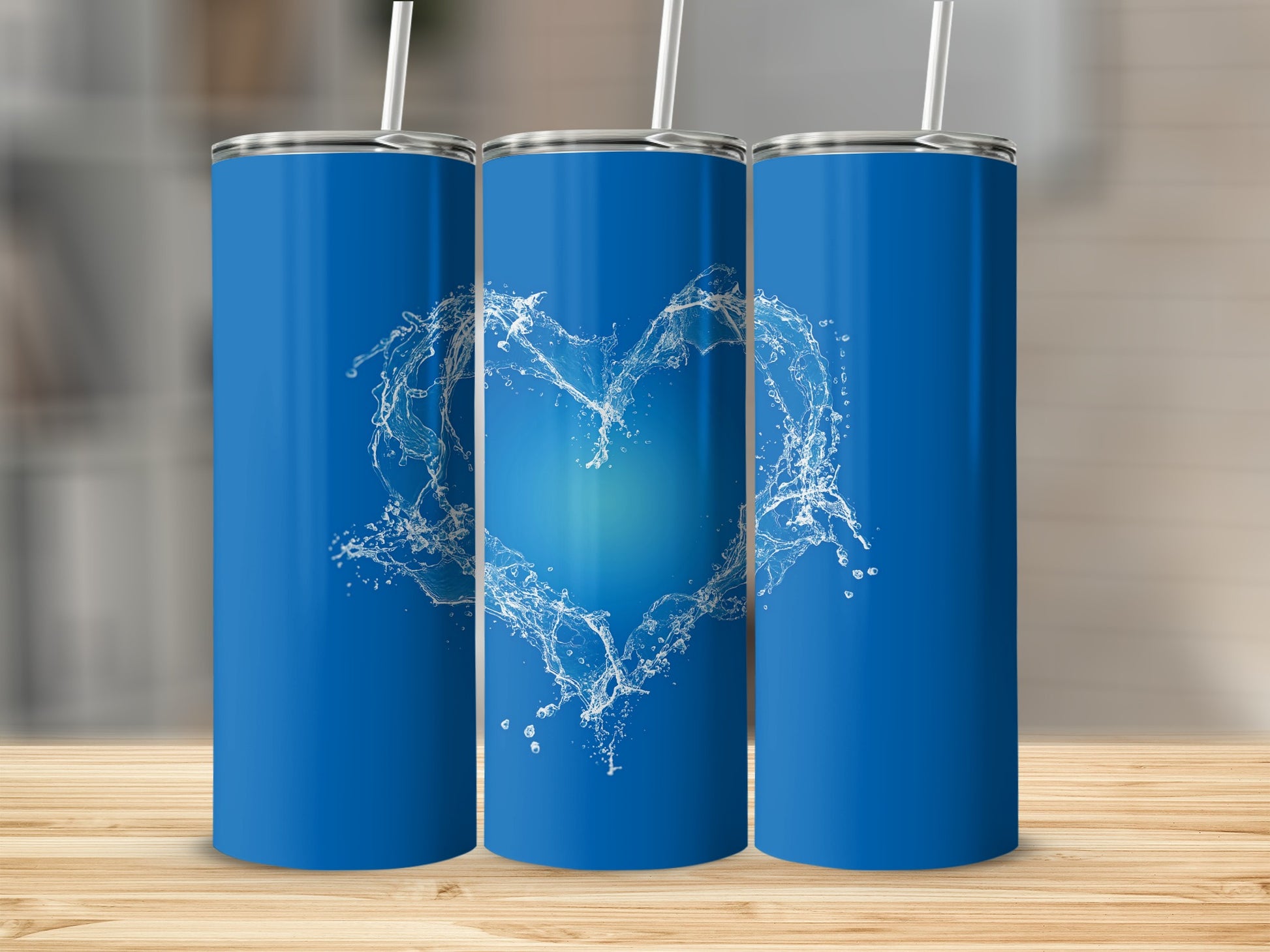 Blue tumbler with a white water splash heart design.