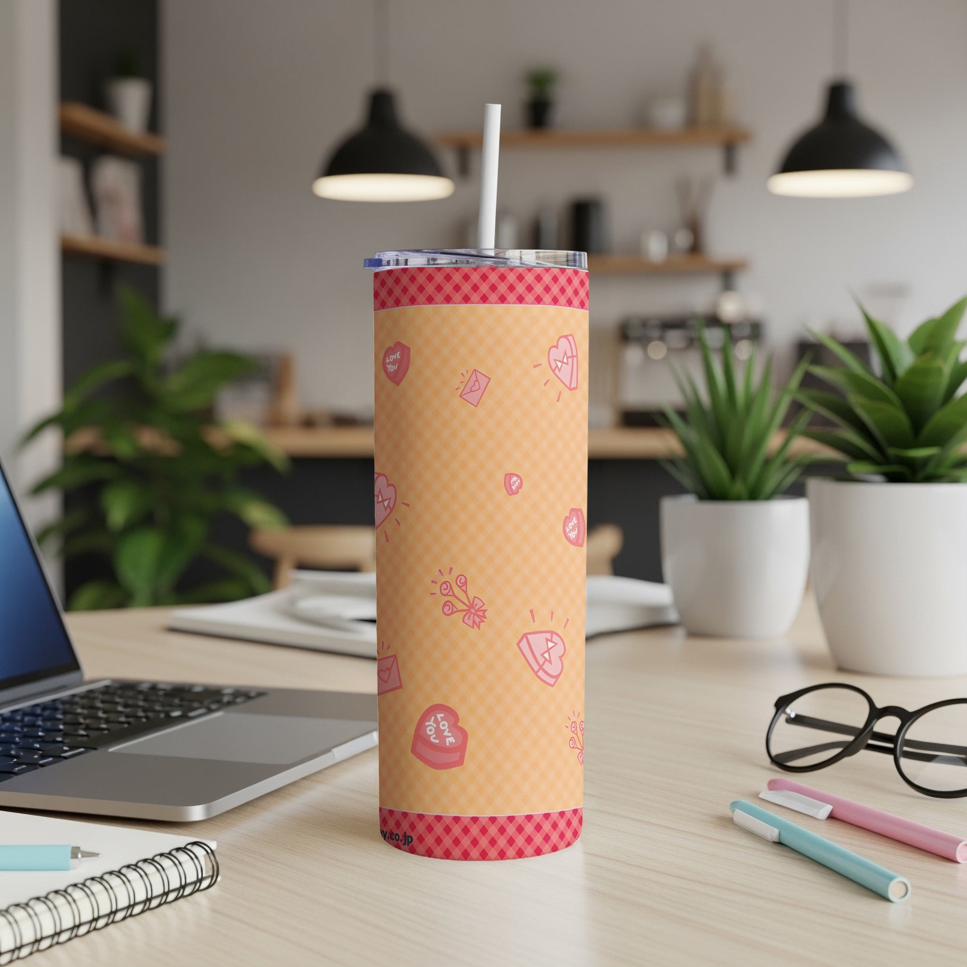 Pink and orange plaid tumbler with hearts and "love you" text.