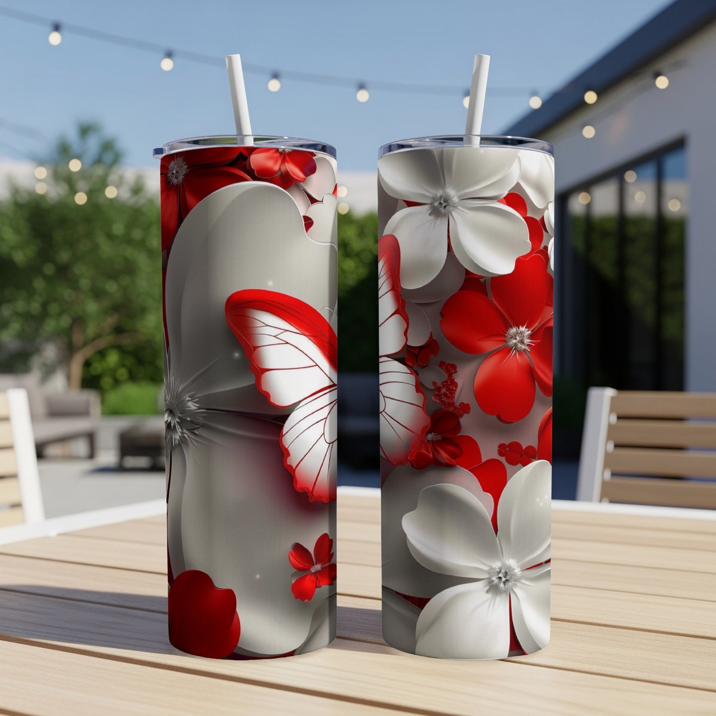 Two tumblers with red and white floral and butterfly designs.