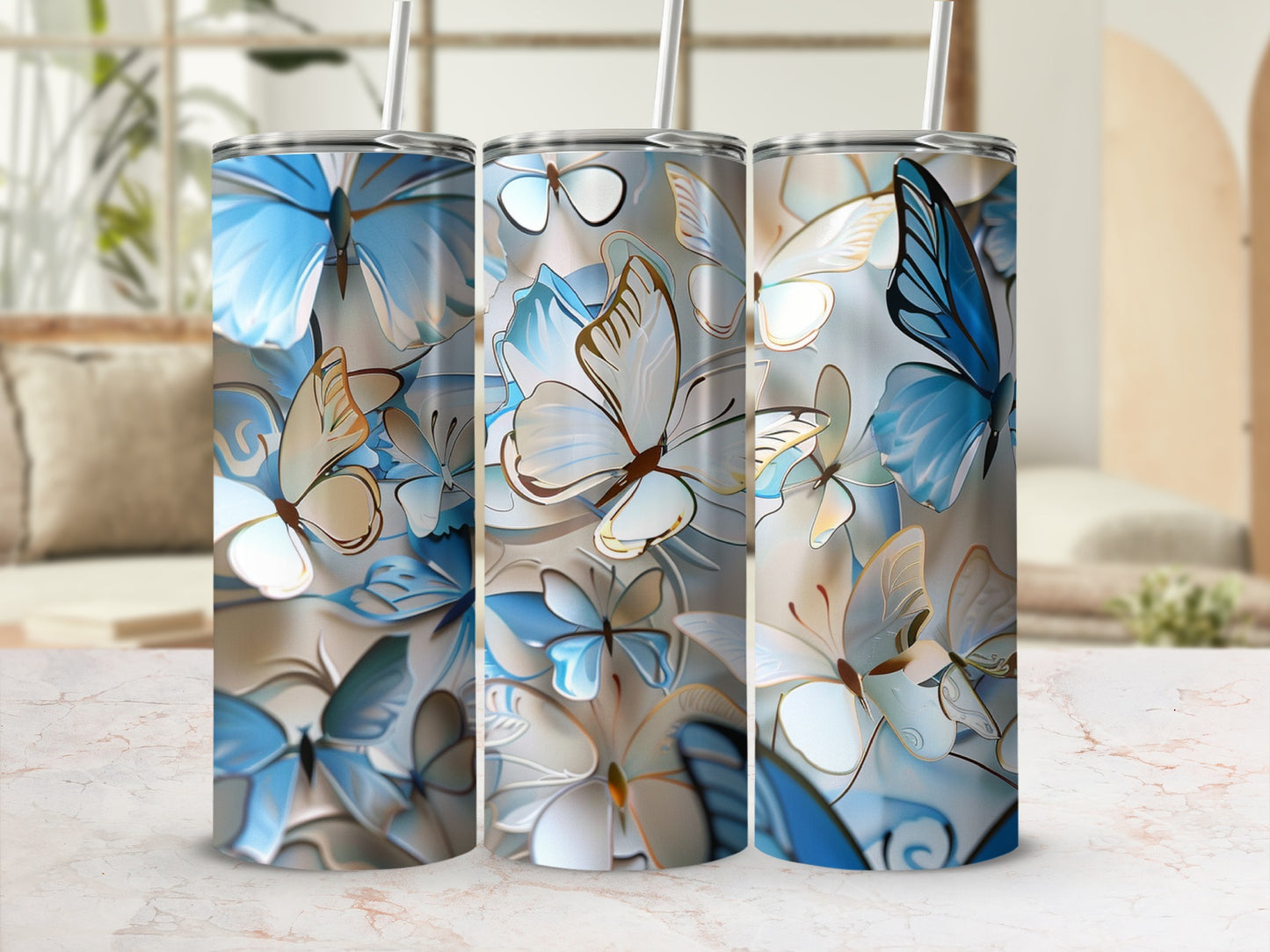 Three tumblers with a blue and gold butterfly design.