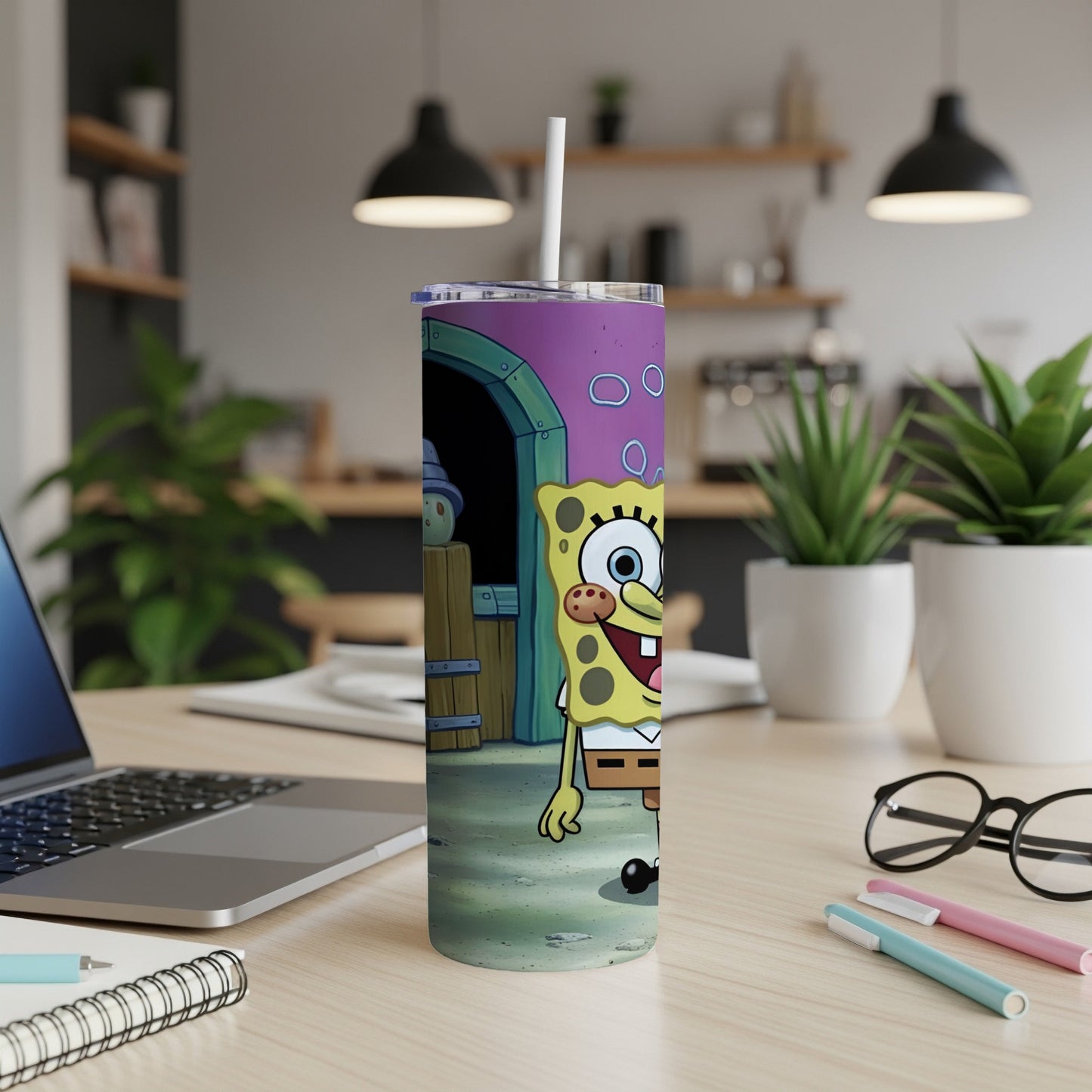 SpongeBob SquarePants character on a purple tumbler with a straw.