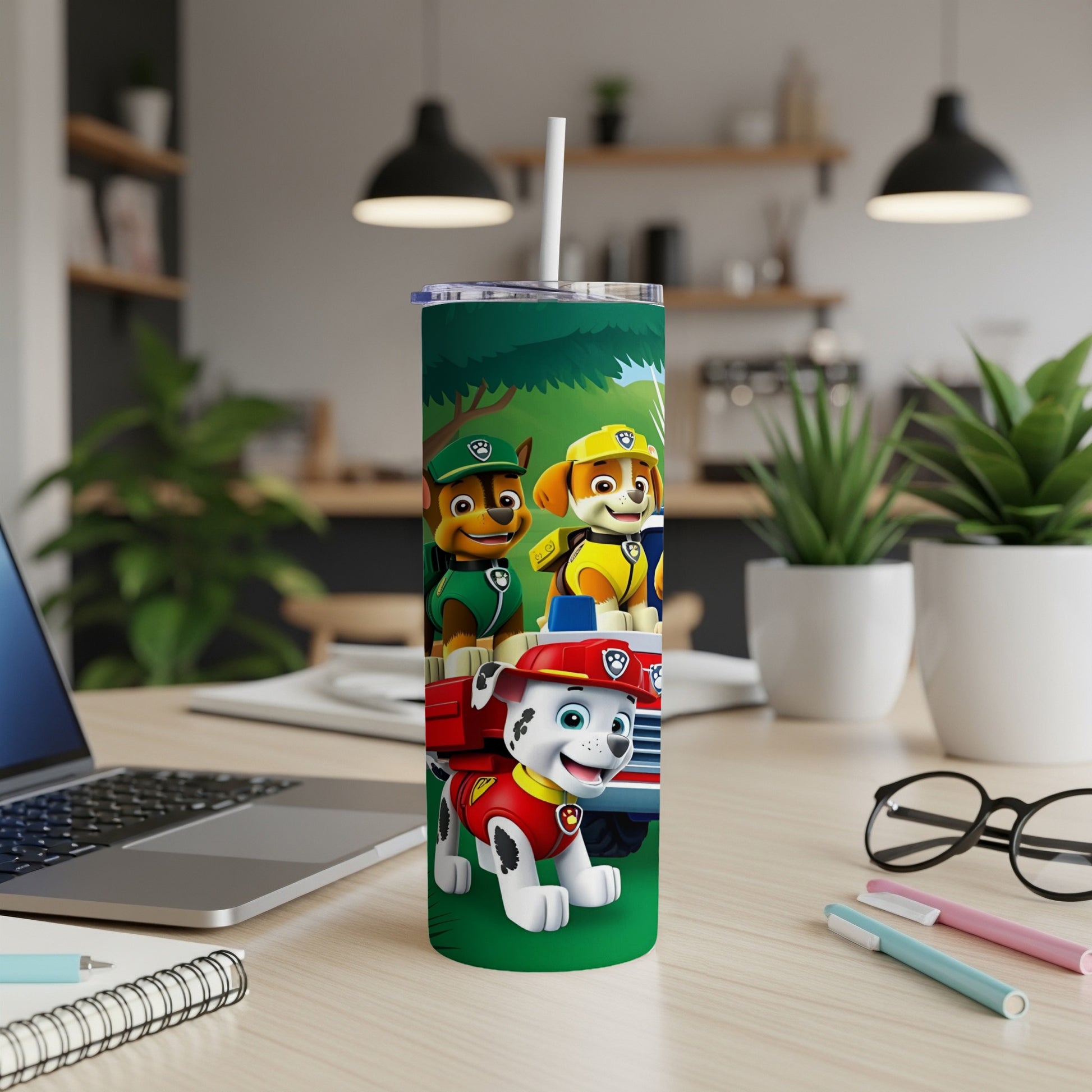 Paw Patrol characters Marshall, Chase, and Rubble on a green tumbler.