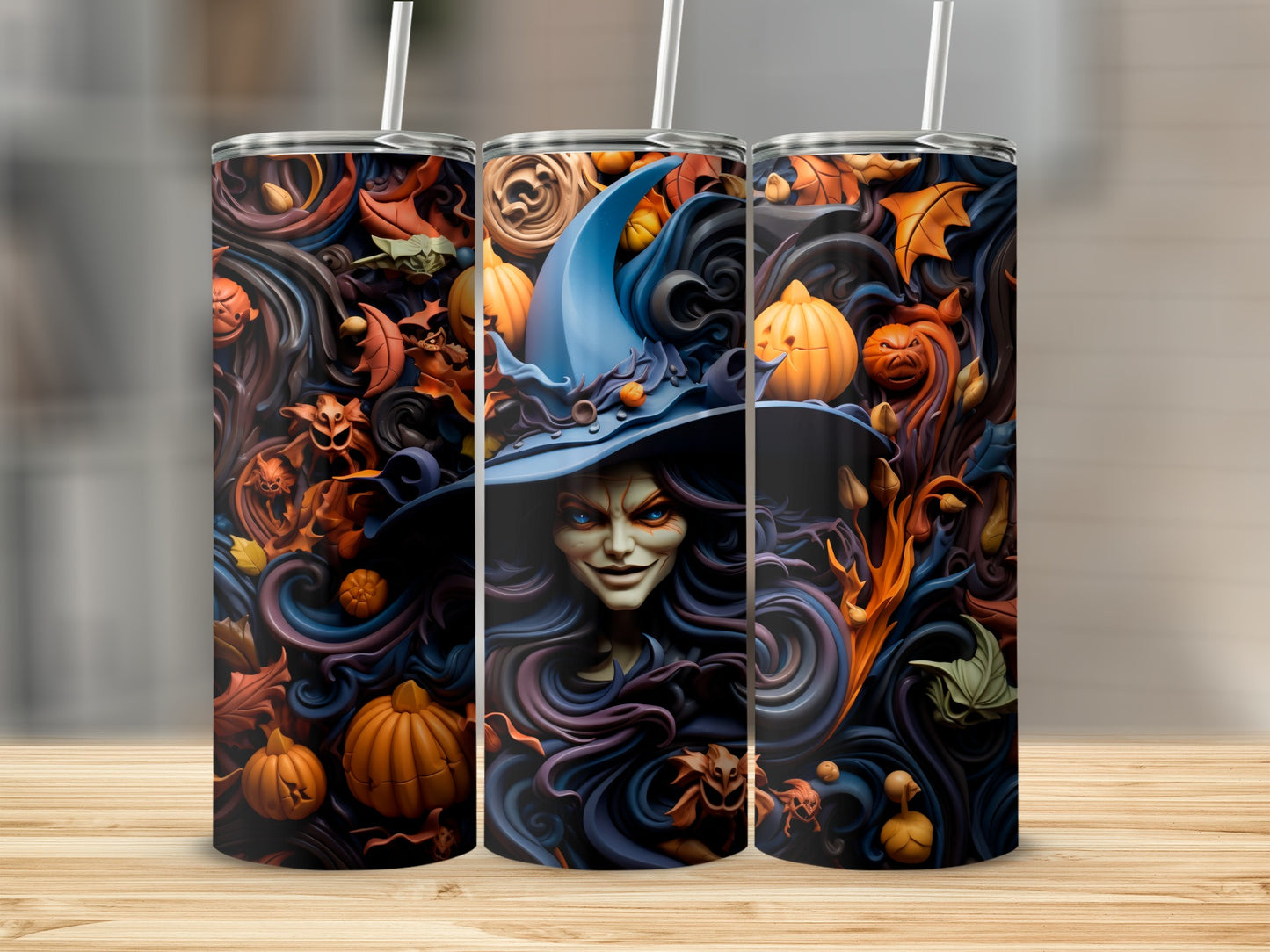 Three tumblers with a dark Halloween design featuring a witch and pumpkins.