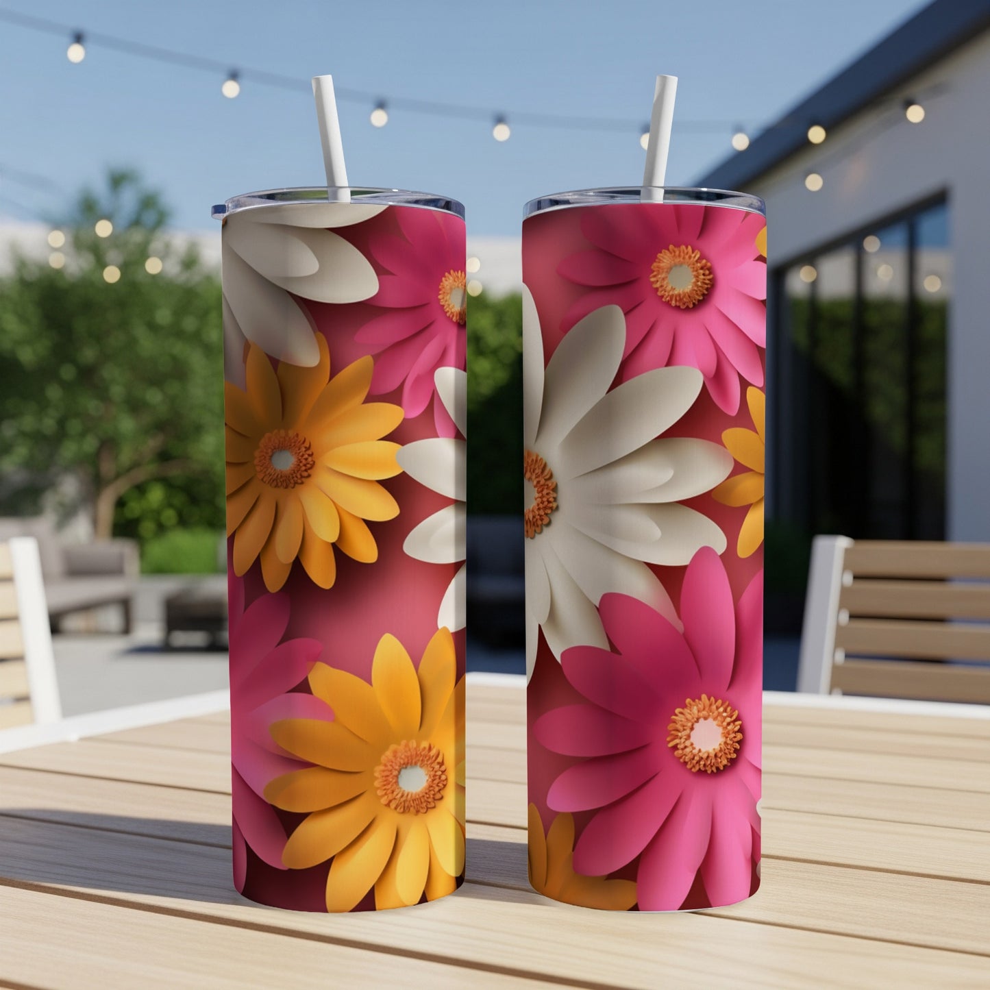 Two tumblers with floral patterns featuring pink, yellow, and white flowers.