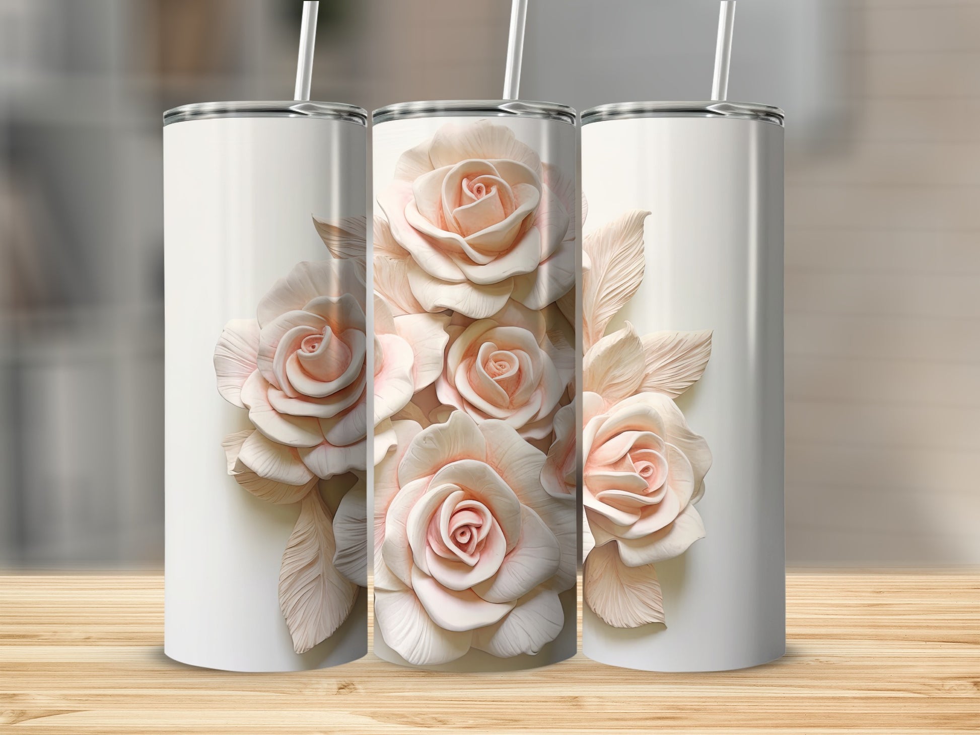 White tumblers with delicate pink roses and leaves on the front tumbler.