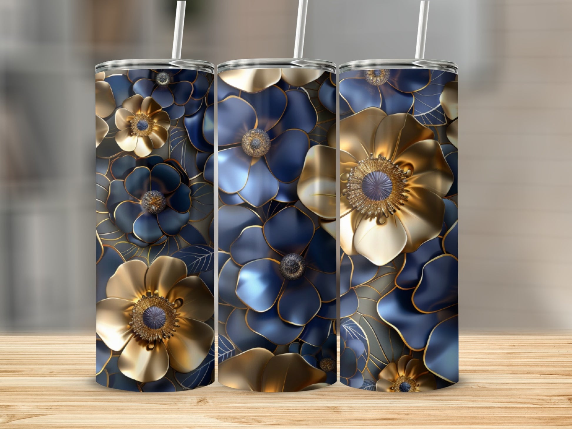 Three blue and gold floral tumblers on a wooden surface.