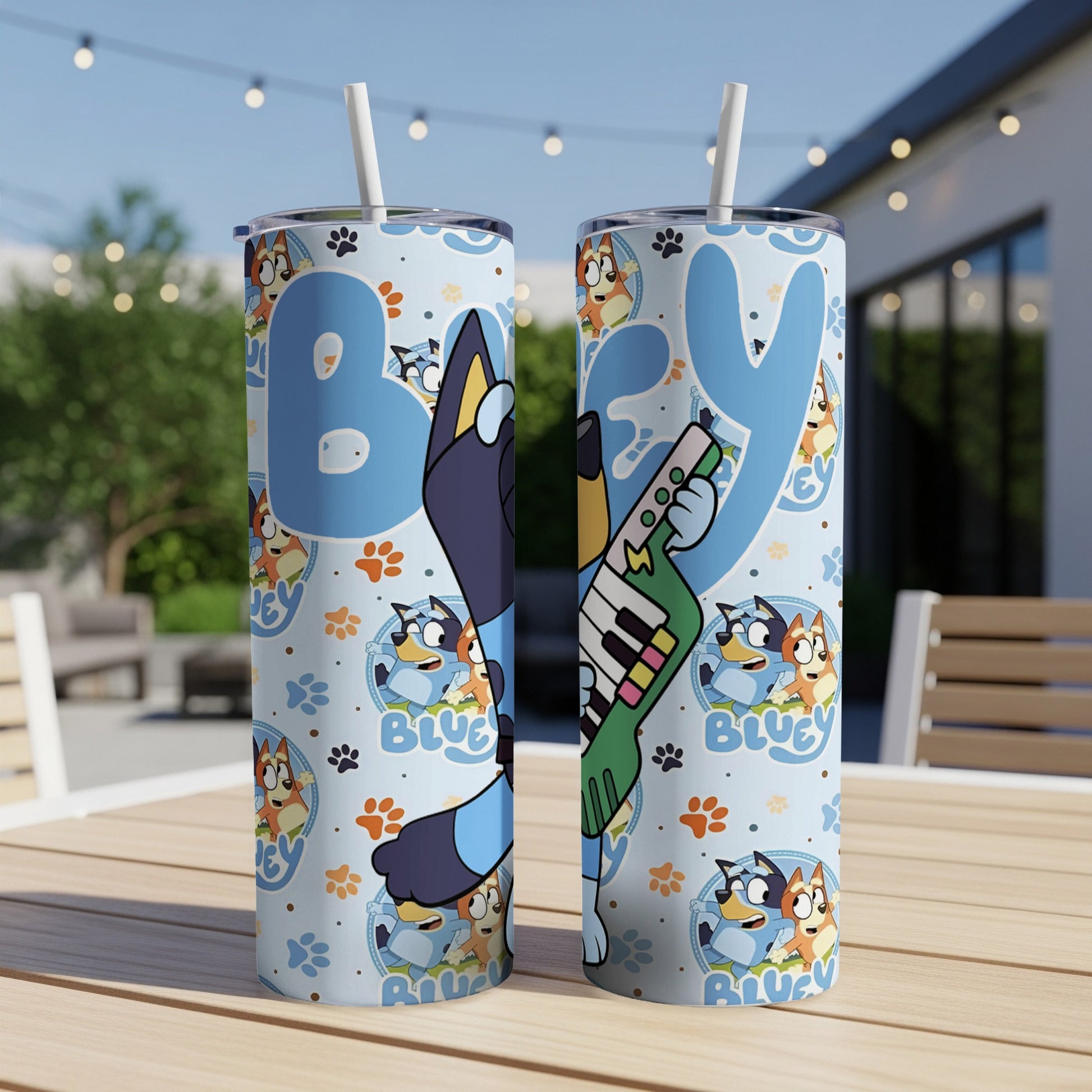 Bluey character design with musical notes on a blue patterned tumbler.