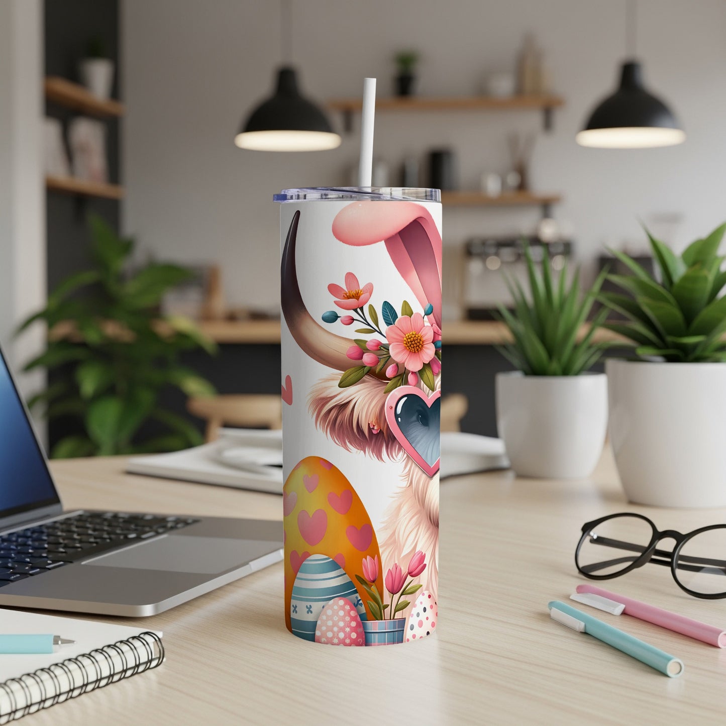 Easter bunny tumbler with bunny ears, hearts, and painted eggs.