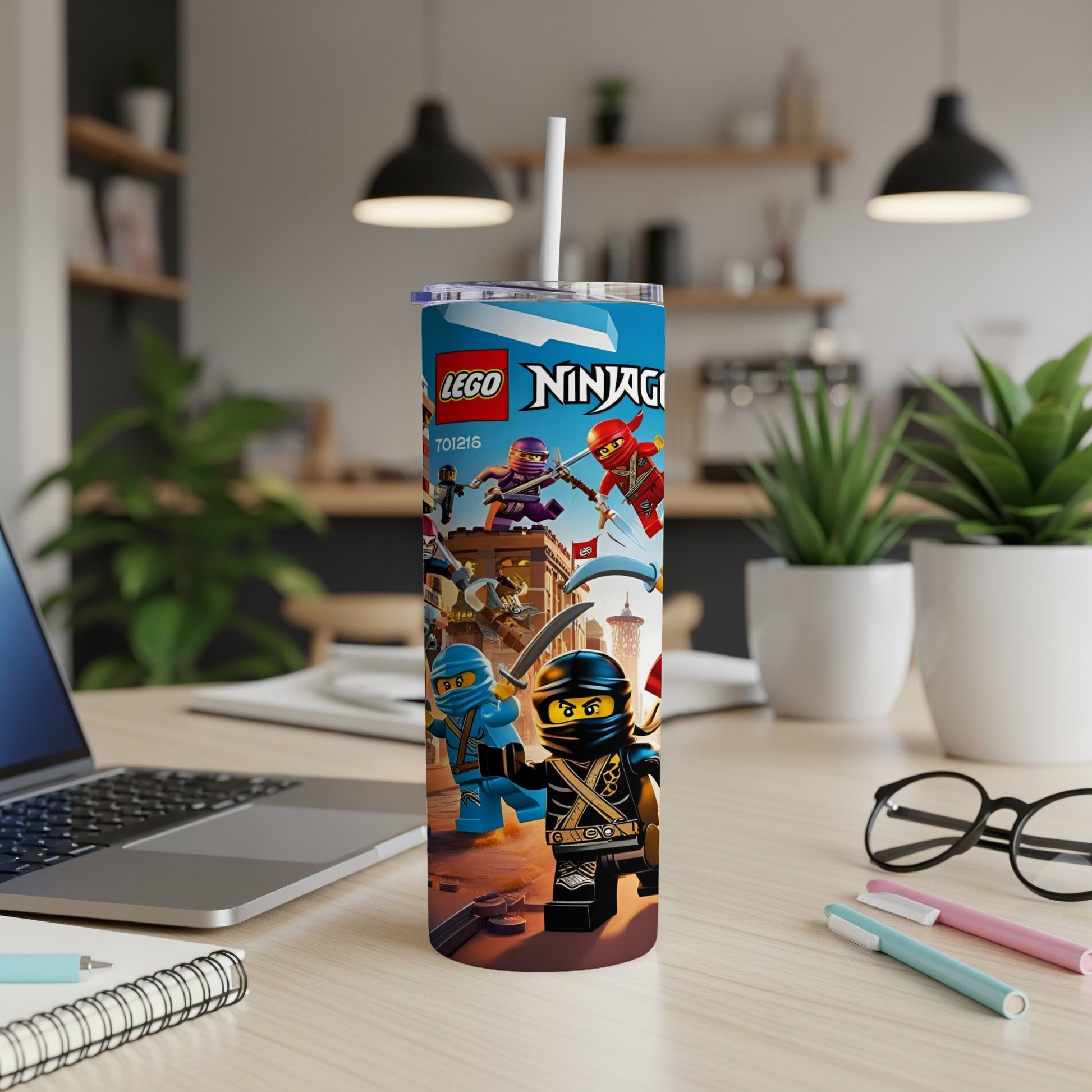 LEGO Ninjago characters on a blue tumbler with a white straw.