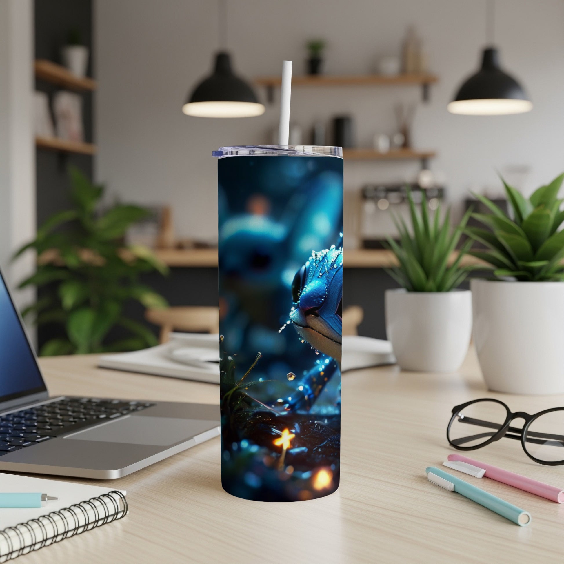 Blue speckled frog on a dark, sparkling background on a tumbler.