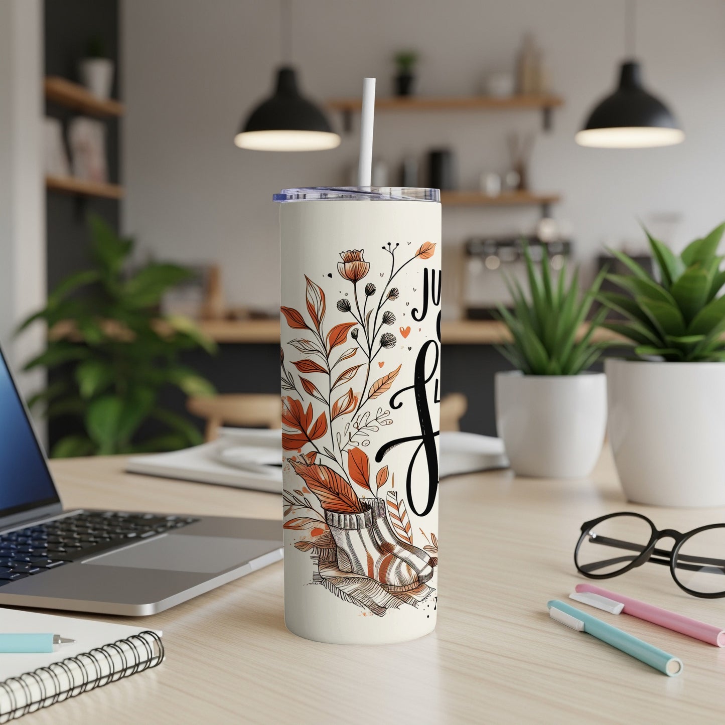 Cream tumbler with floral design and "Just Here for the Snacks" text.