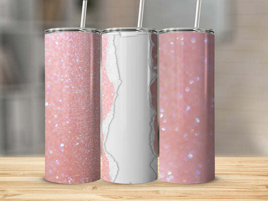 Three pink glitter tumblers with straws on a wooden surface.