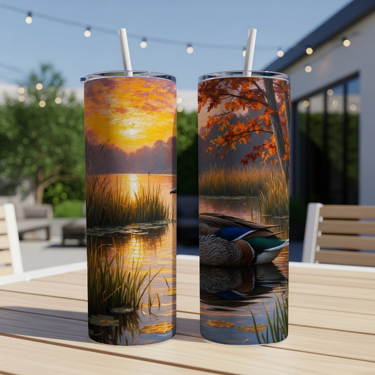 Two tumblers with waterfowl art, one sunrise, one autumn scene.
