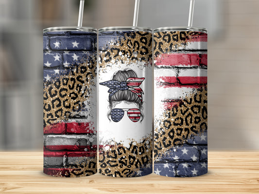 Tapered tumbler with distressed US flag, leopard print, and messy bun graphic.