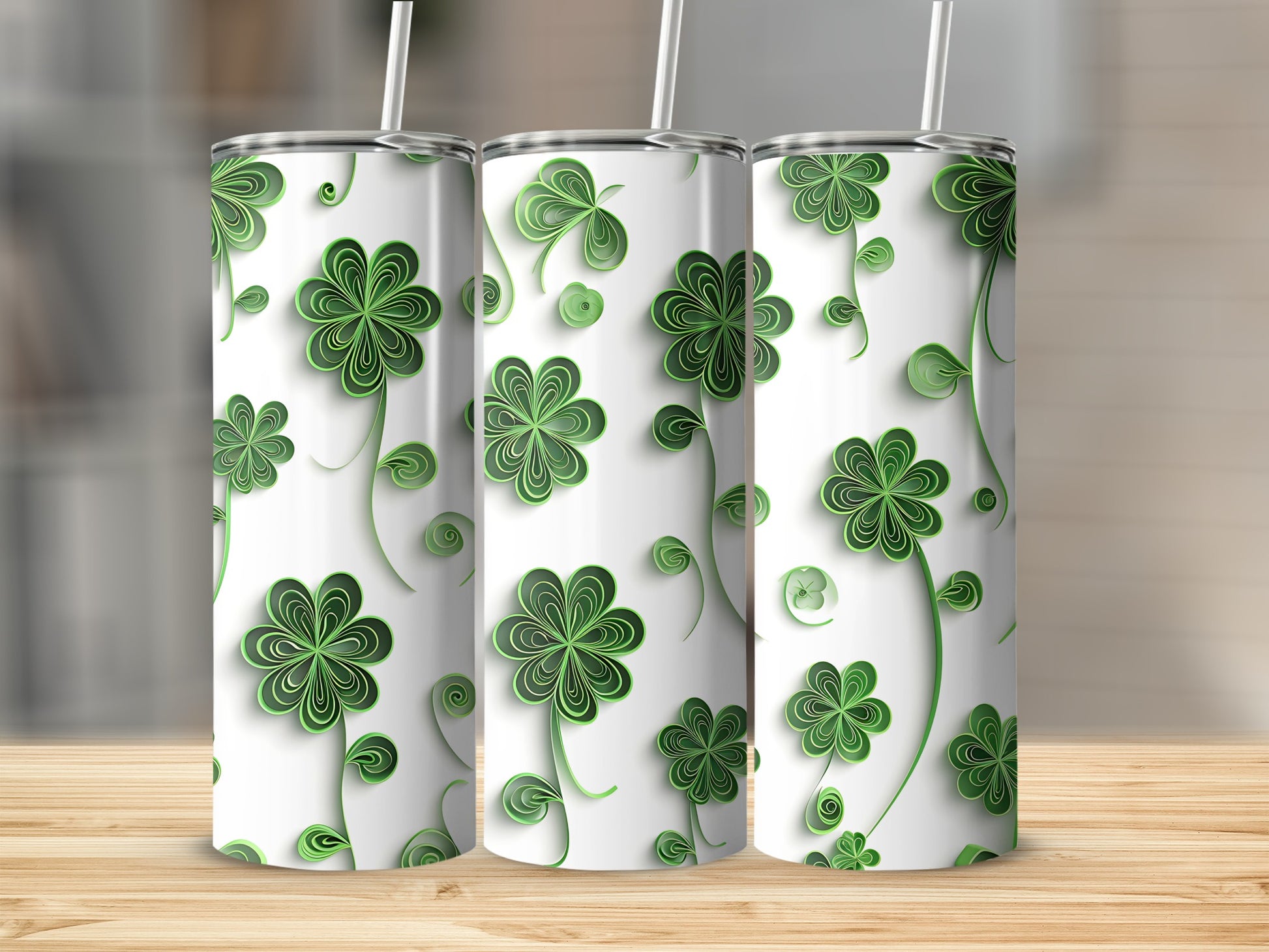 Three tumblers with a repeating green shamrock clover pattern on a white background.