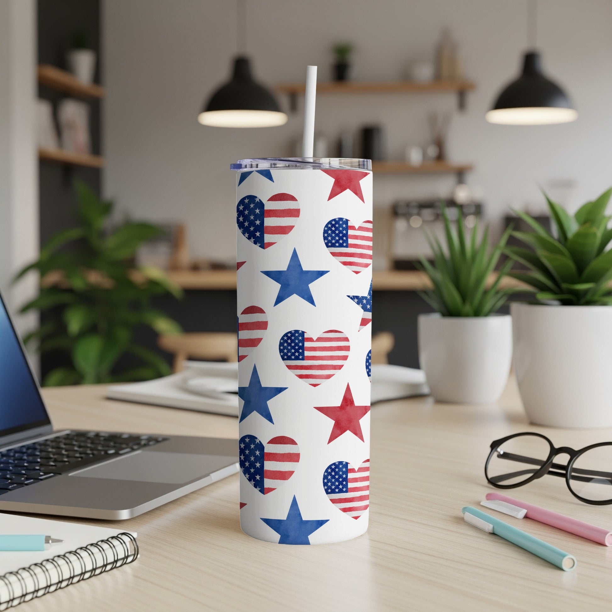 White tumbler with red and blue American flag hearts and stars pattern.