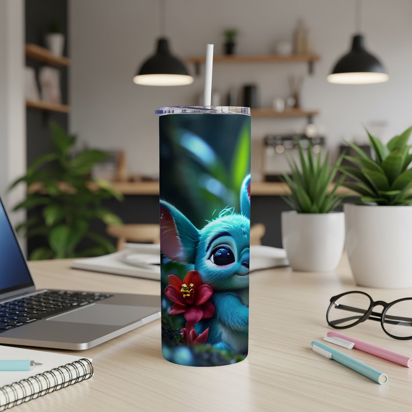 Blue creature with large ears and a red flower on a tumbler.