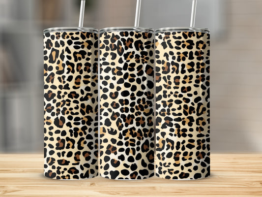 Three tumblers with leopard print and white straws.