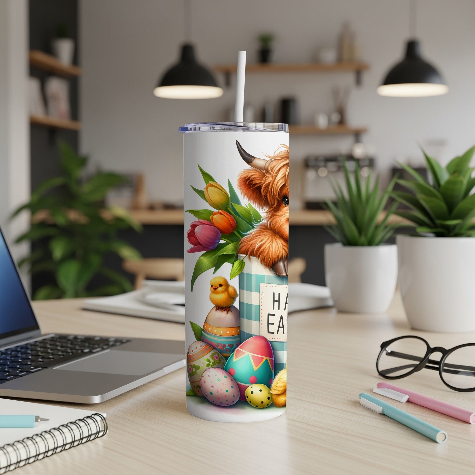 Highland cow and Easter eggs on a tumbler with "Happy Easter" text.