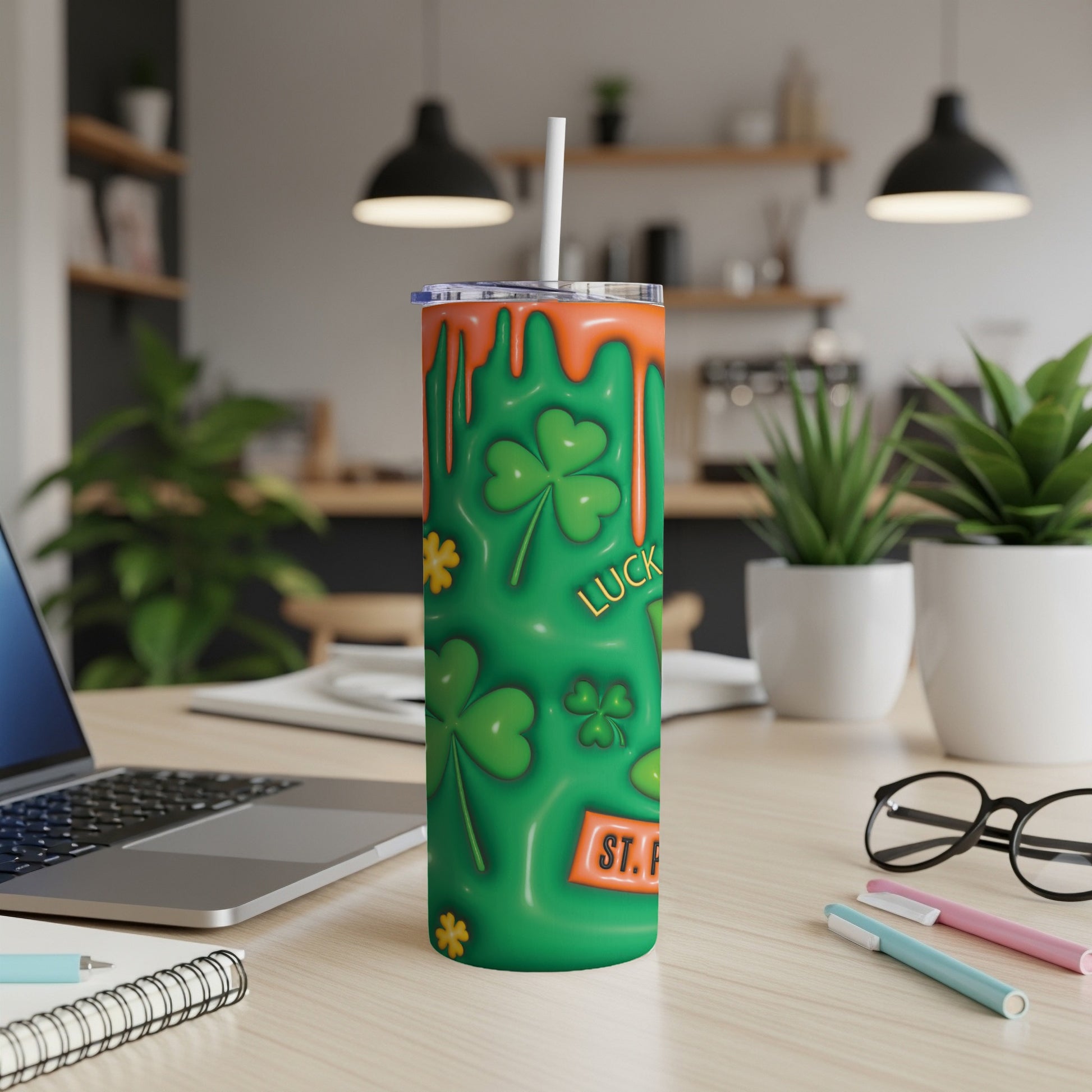 Green tumbler with shamrocks and "St. Patrick's Day" text.