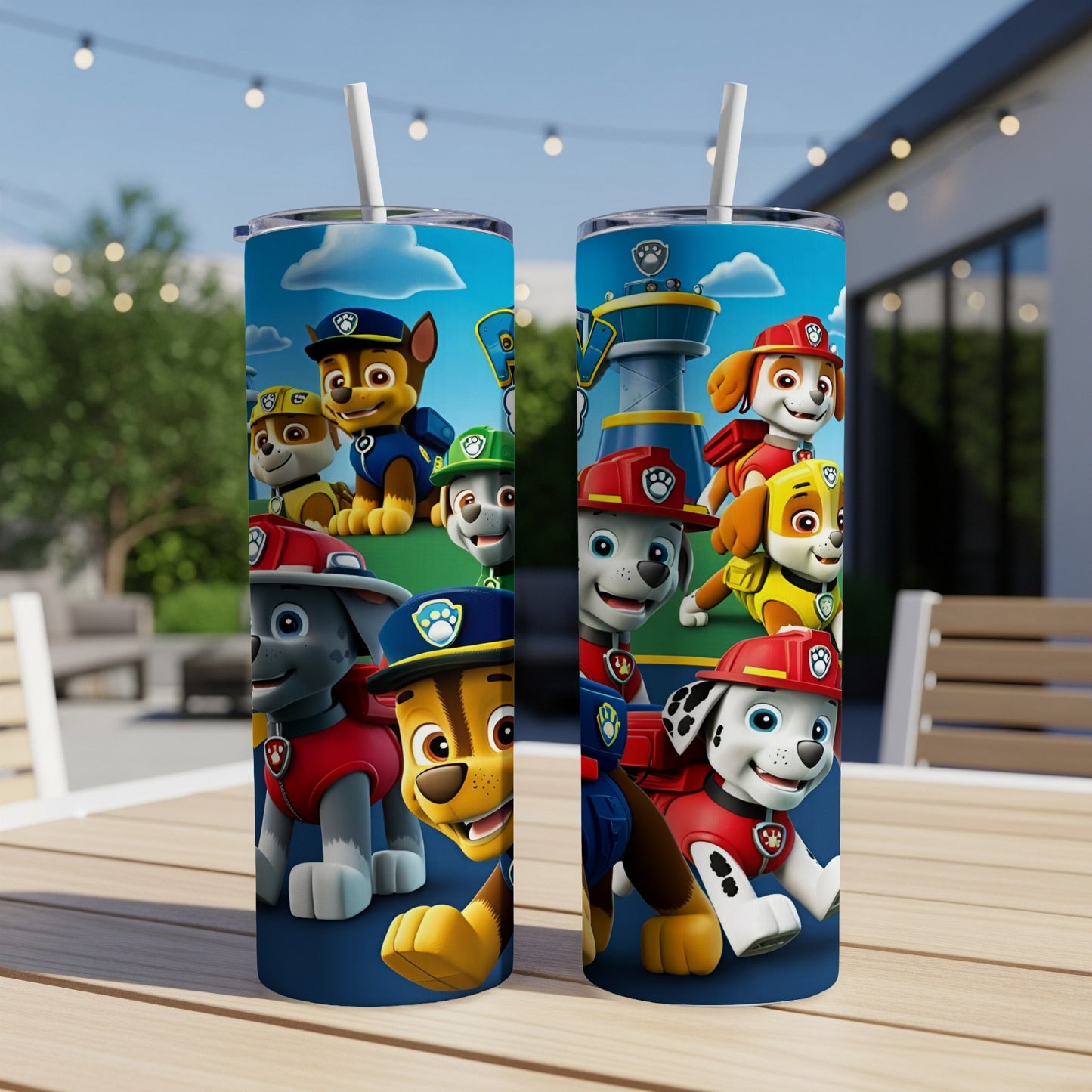 Paw Patrol characters on a blue tumbler with straws, outdoors.
