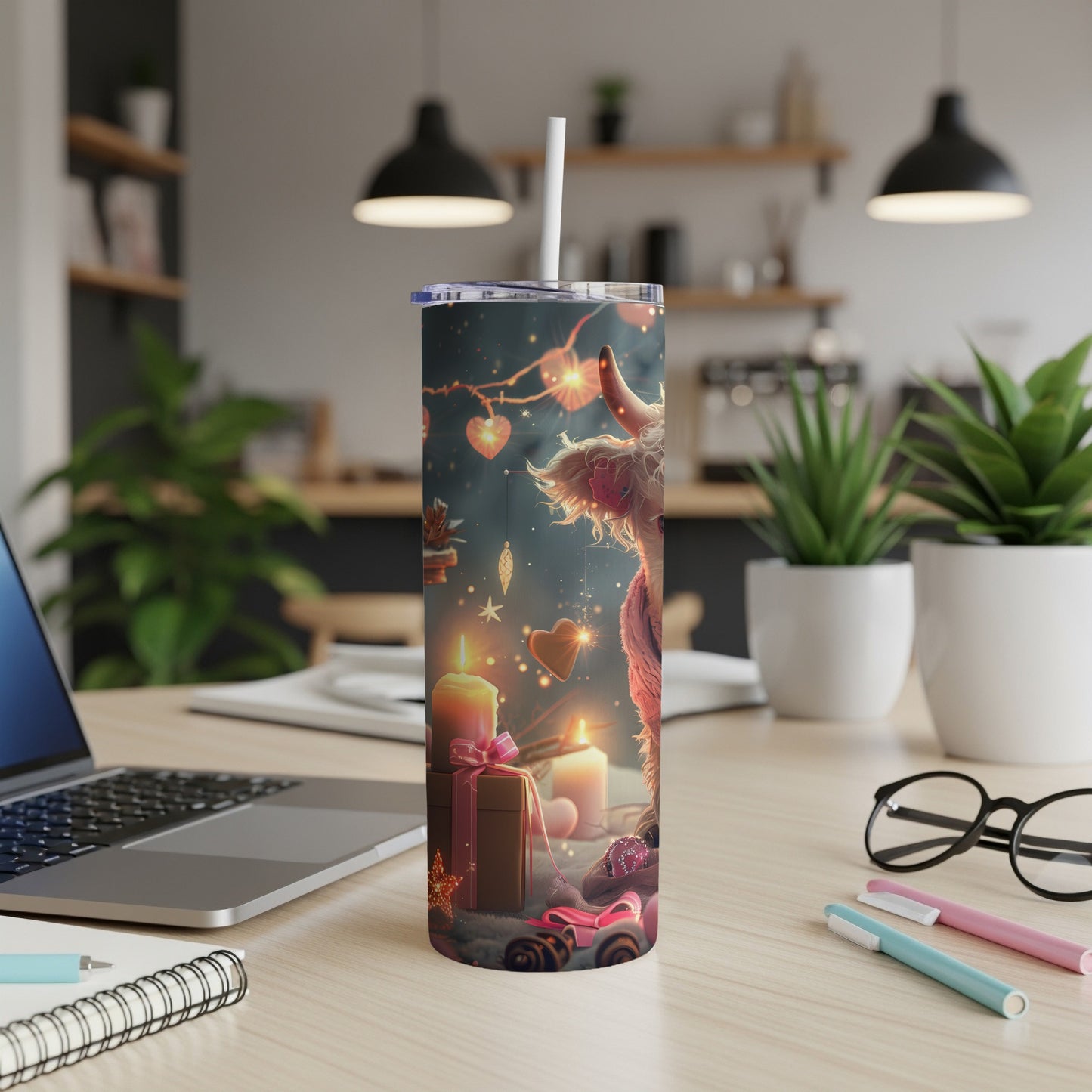 Llama and heart design on a tumbler with a straw, on a desk.