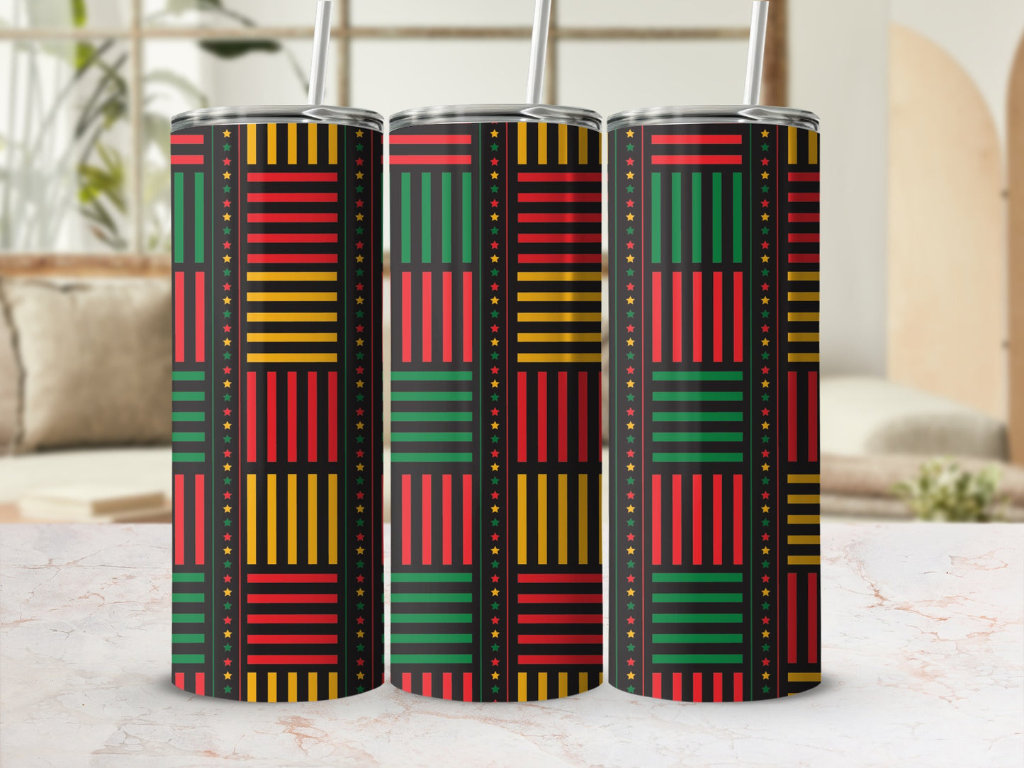 Three tumblers with a black background and a Kente-inspired pattern of red, yellow, and green stripes and stars.