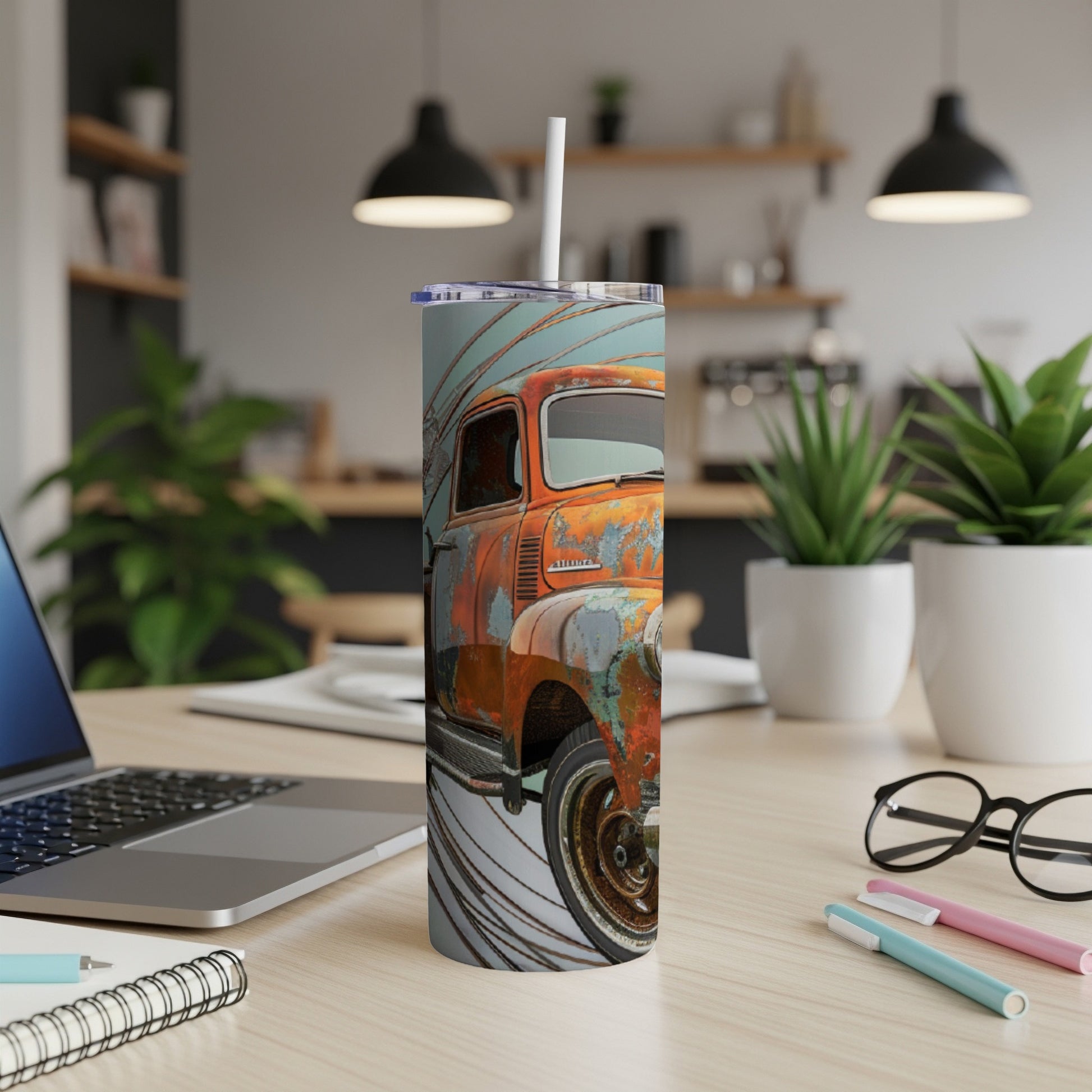 Rusting vintage pickup truck on a cylindrical tumbler with straw.