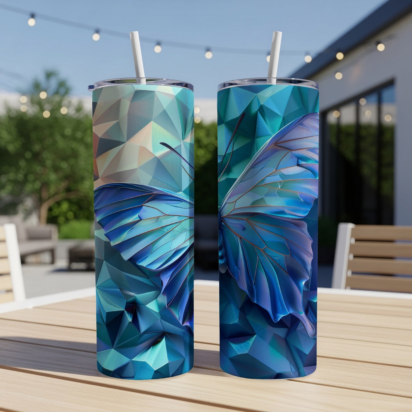 Two tall tumblers with iridescent blue butterfly wings on geometric crystal backgrounds.