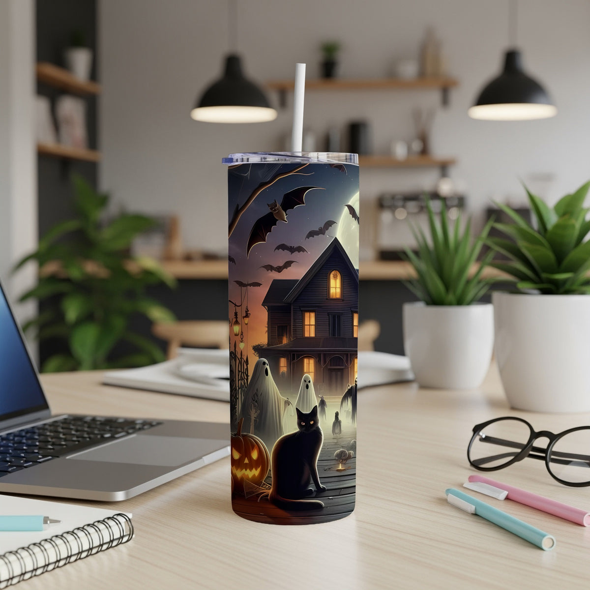 Halloween tumbler with black cat, ghosts, bats, and haunted house design.