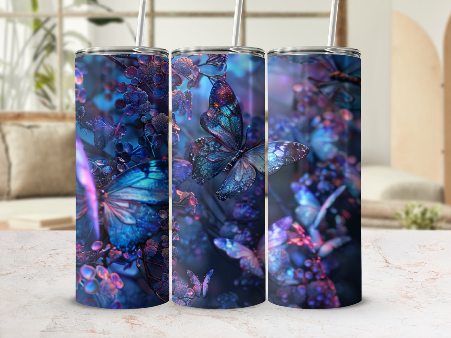 Three tumblers with iridescent blue butterflies and purple berries against a dark, blurred background.
