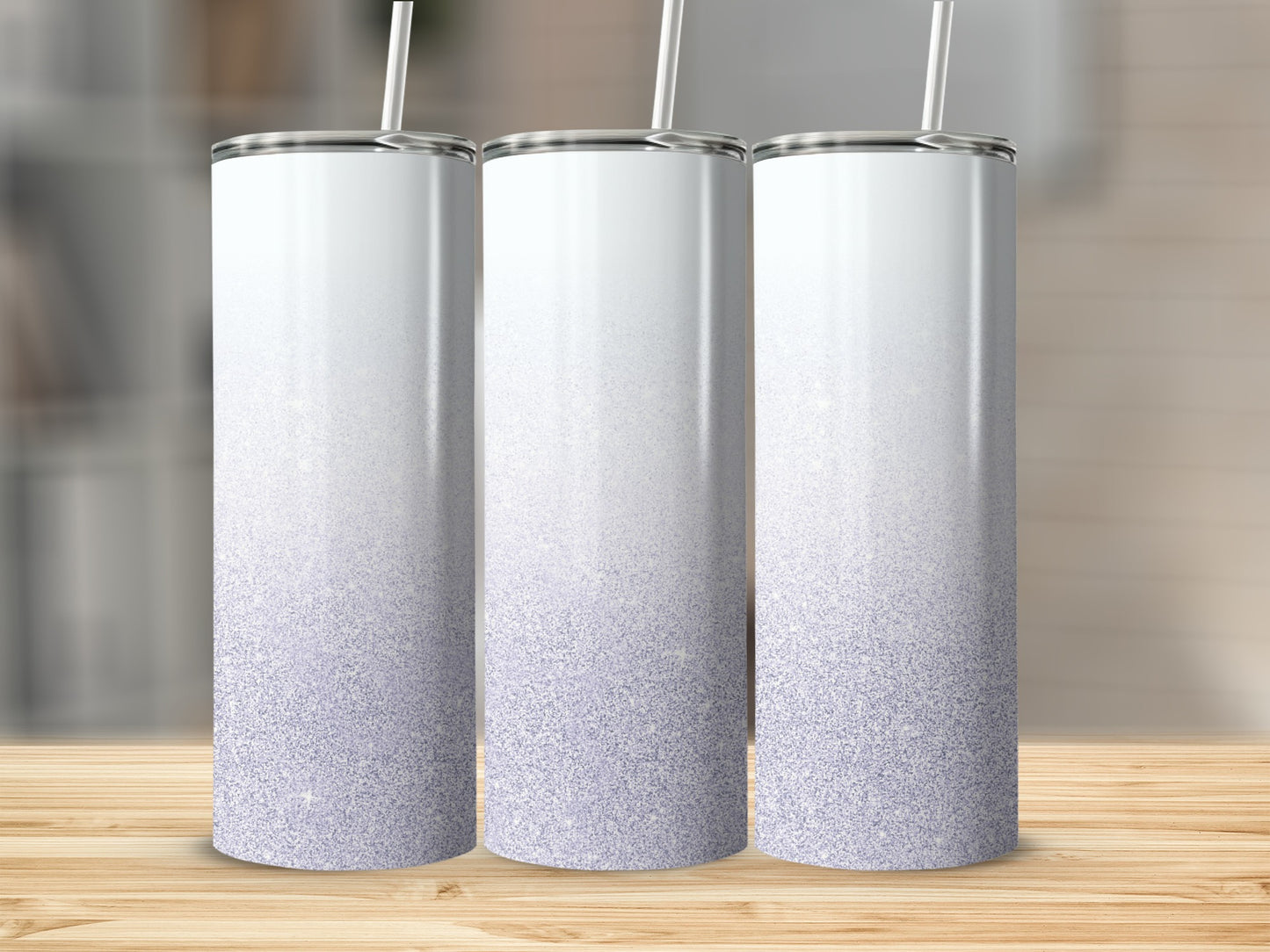 Three white tumblers with a purple glitter gradient on a wooden surface.