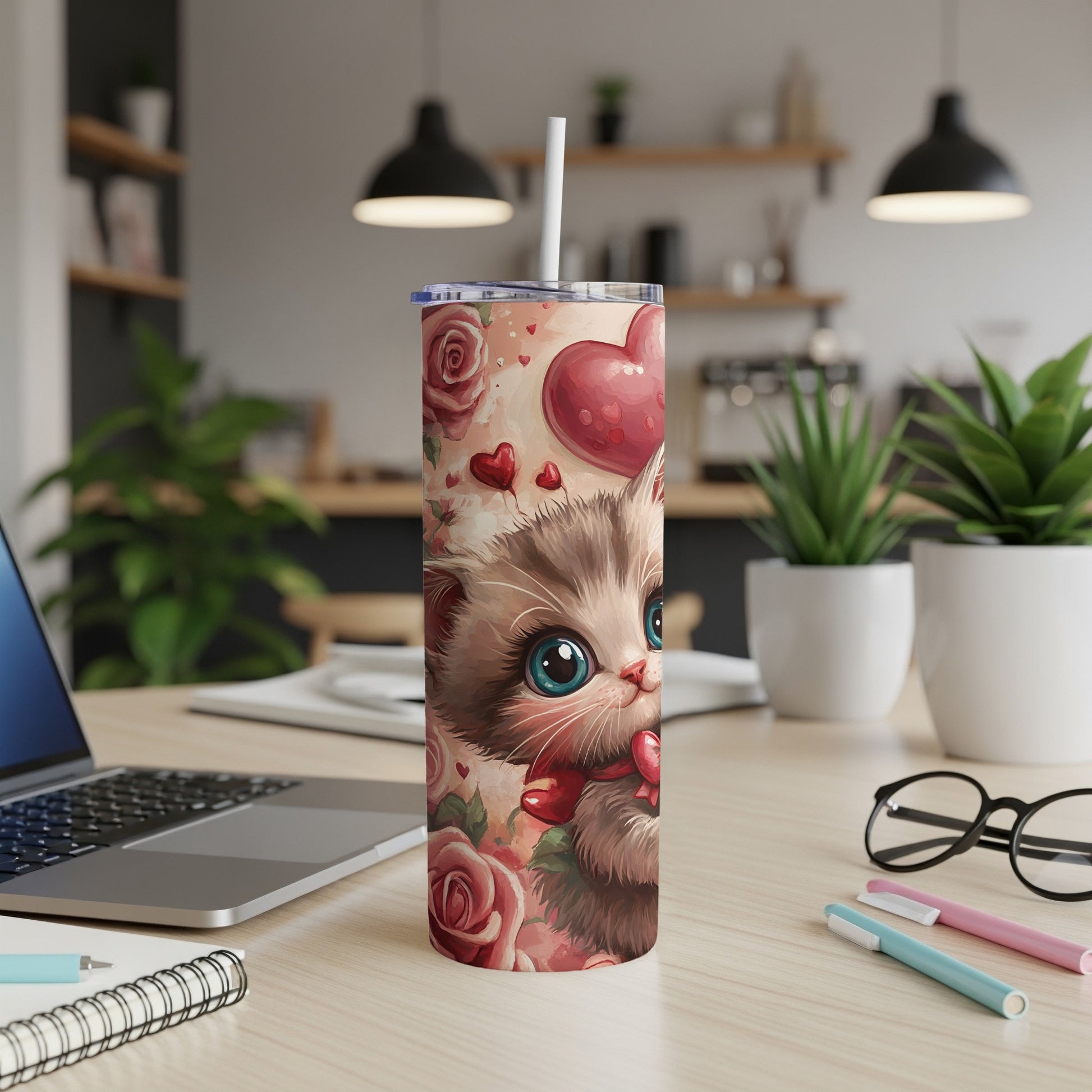 Pink tumbler with a cute cat illustration surrounded by roses and hearts.