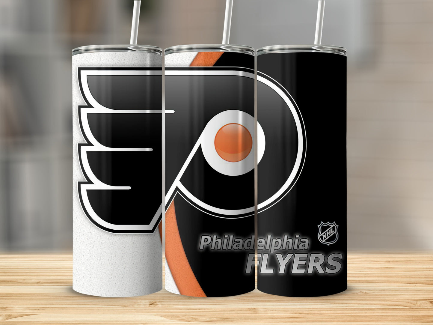 Philadelphia Flyers tumblers with logo and text on a wooden surface.