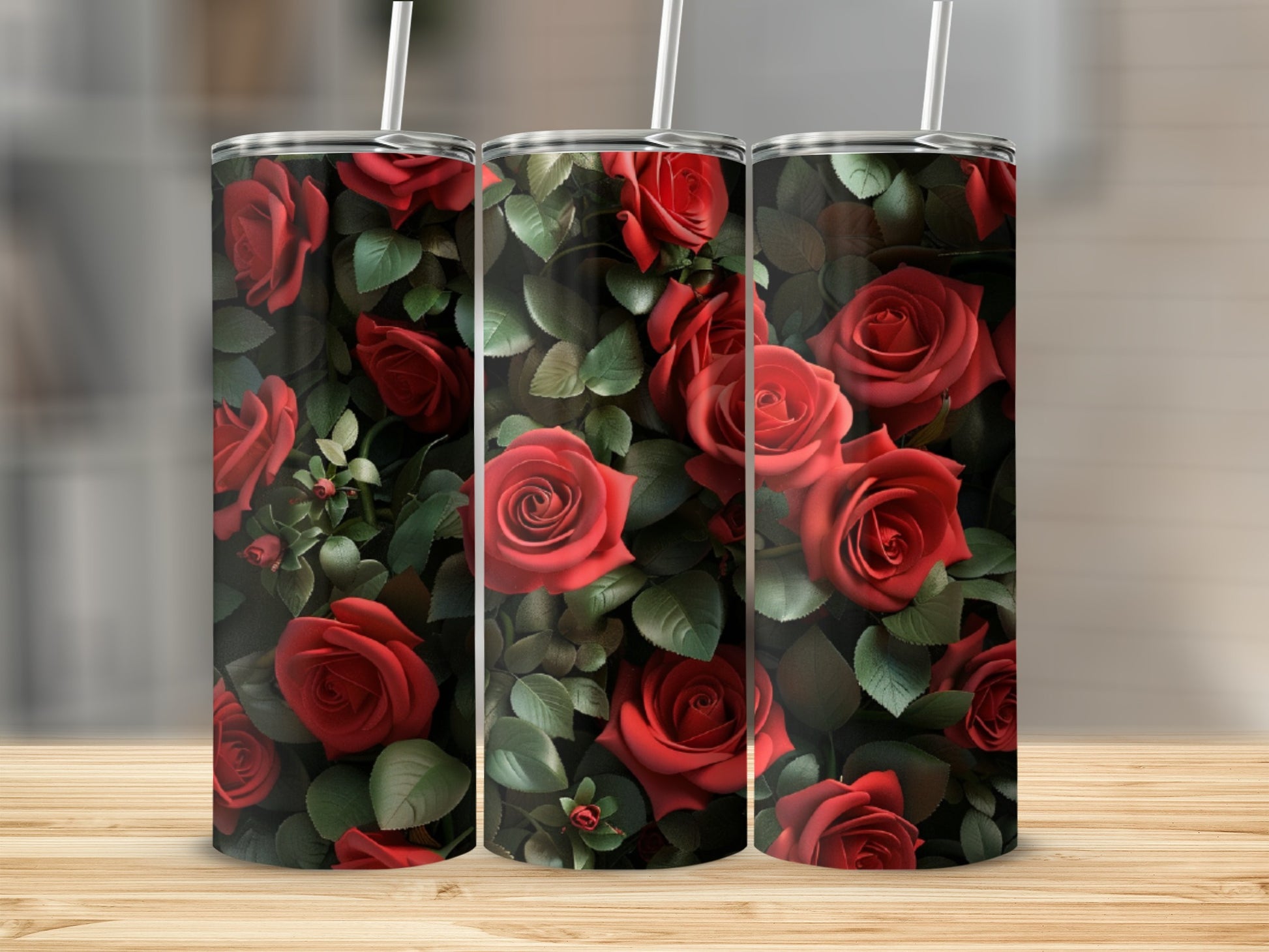 Red roses and green leaves pattern on a cylindrical tumbler with straw.