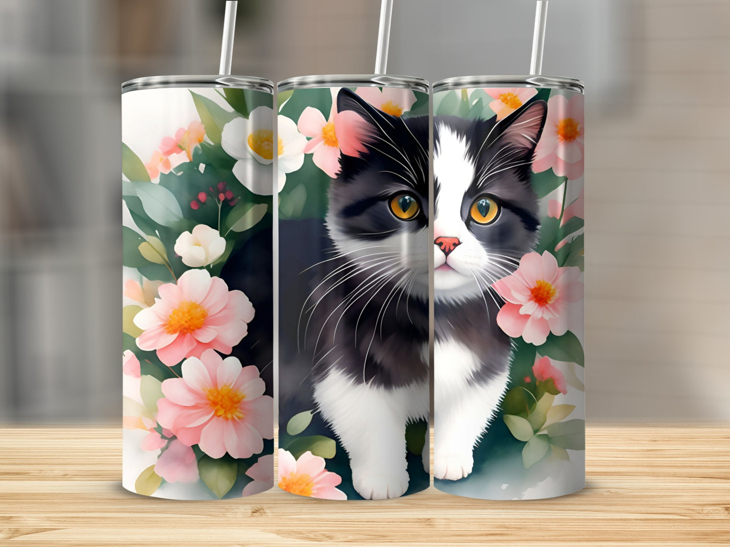 Tuxedo cat among pink flowers on a decorative tumbler.