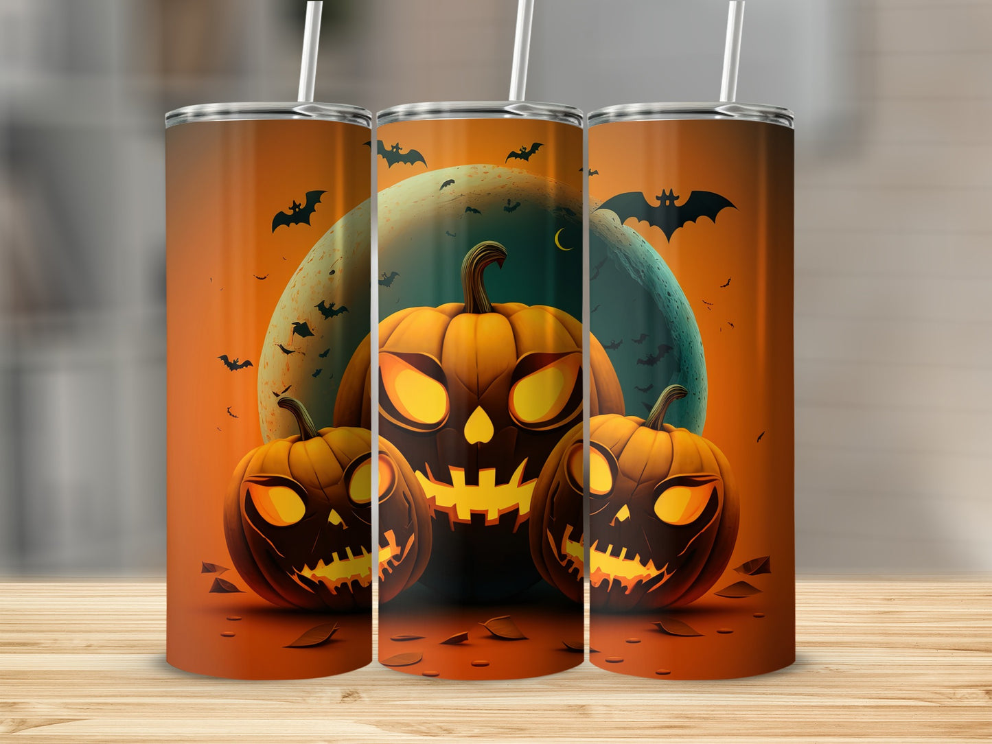 Three tumblers with a Halloween design featuring jack-o'-lanterns, bats, and a crescent moon.