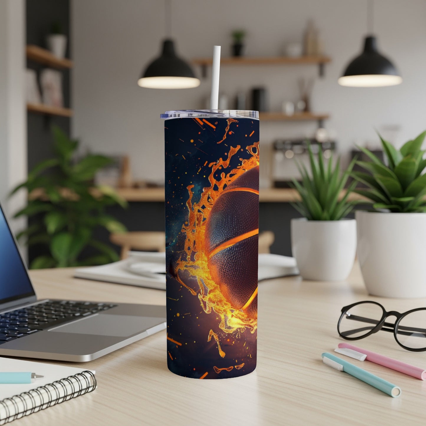 Basketball on fire design on a tumbler with a straw.