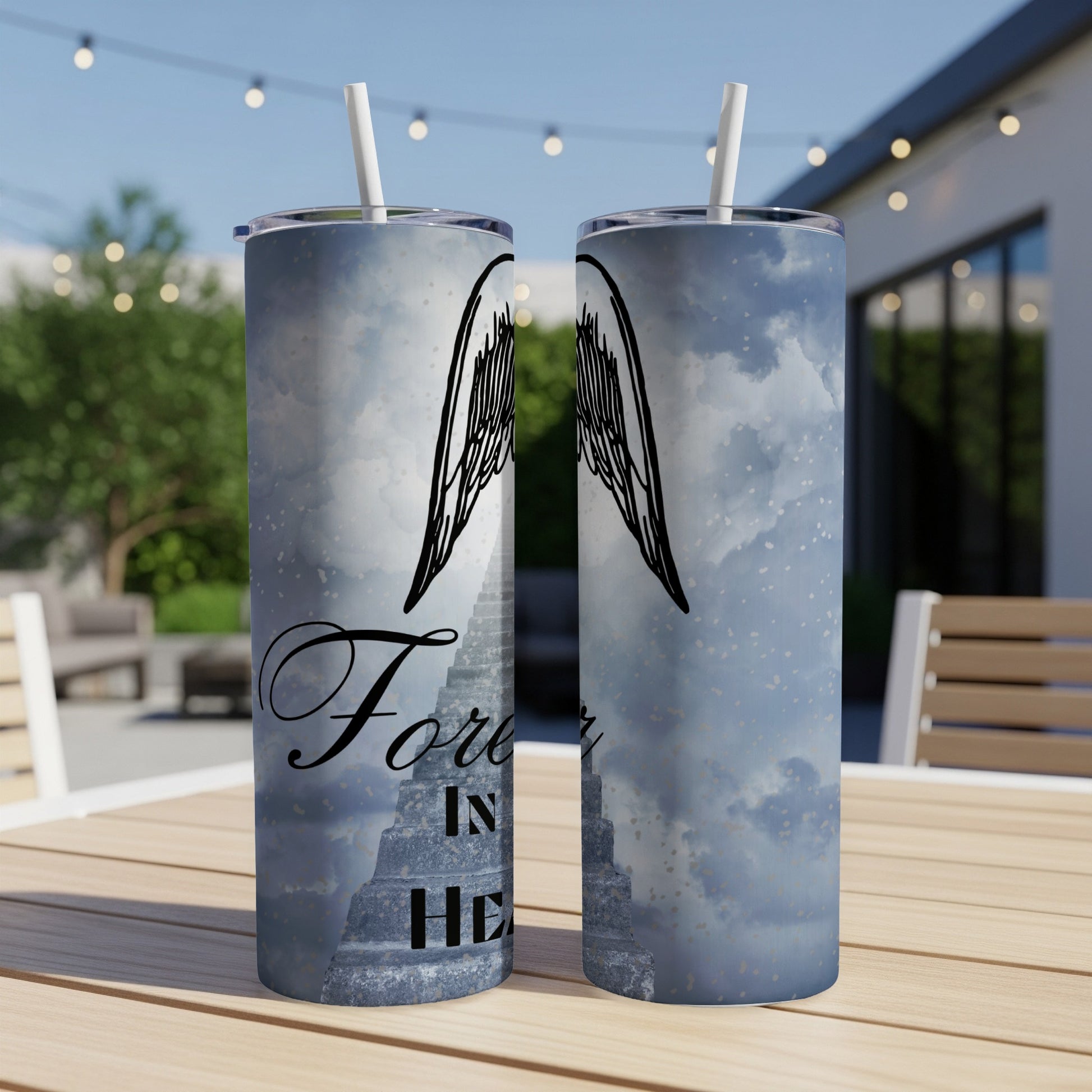 Two tumblers with a stairway to heaven and angel wings design.