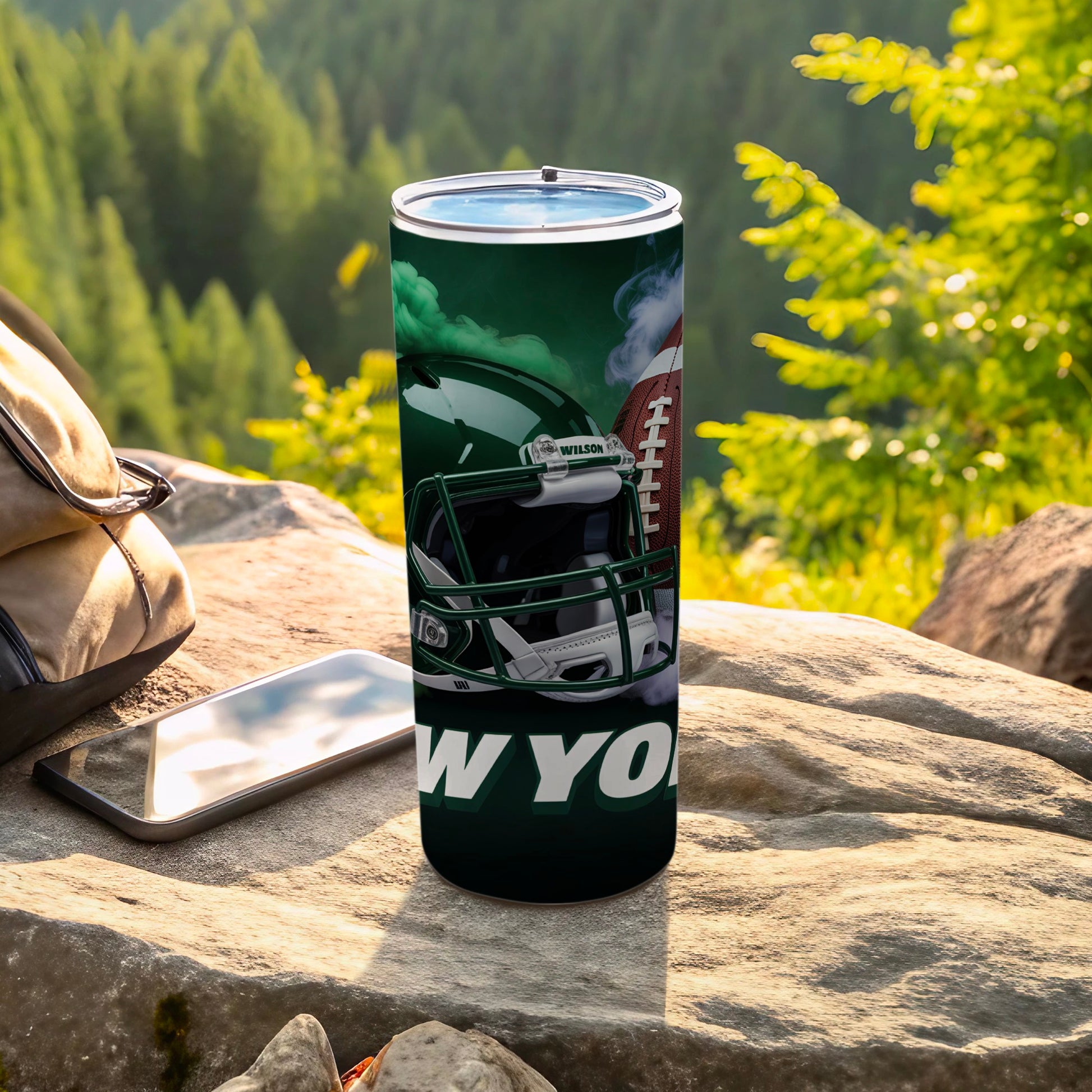 Green and white New York Jets football helmet and ball on tumbler.
