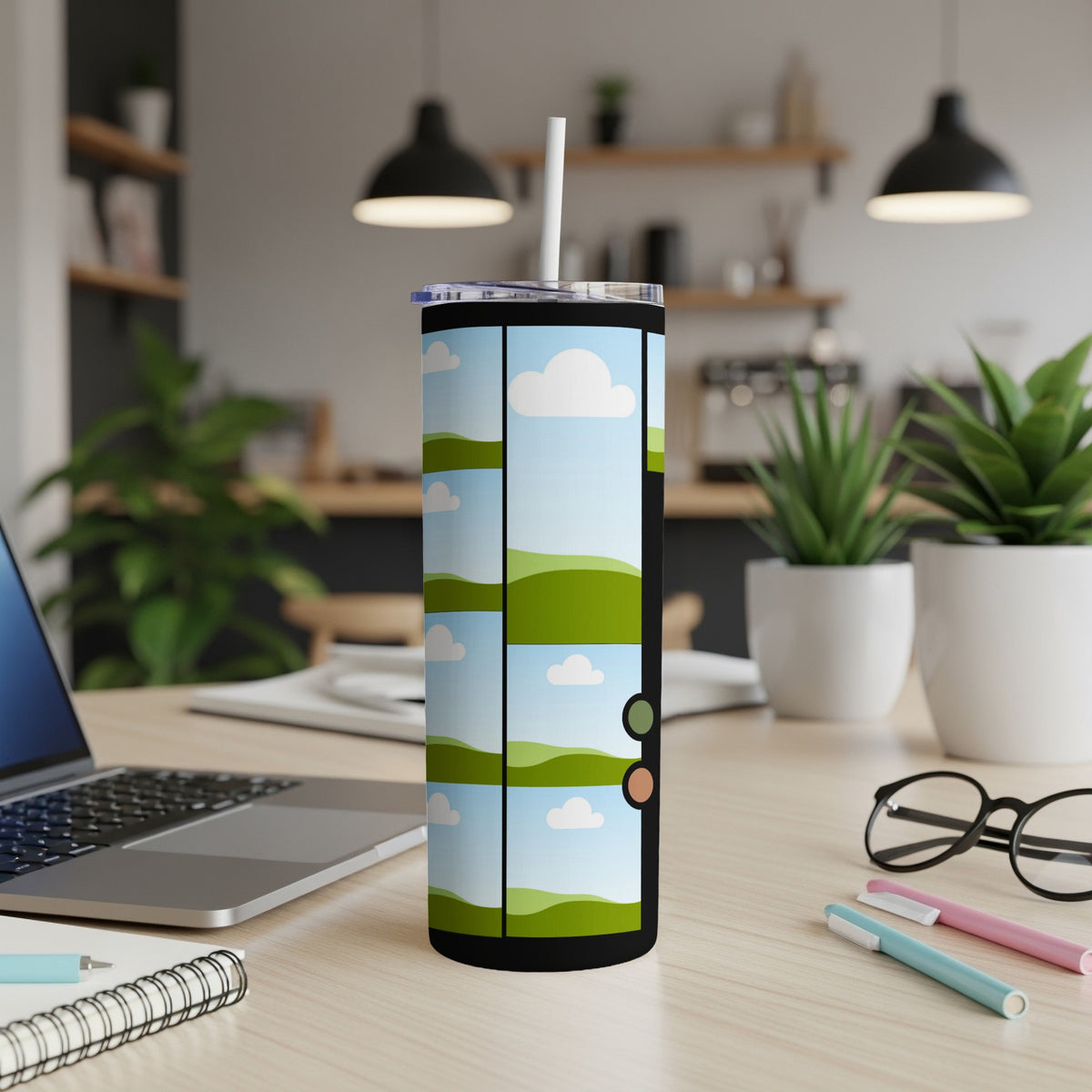 Tall tumbler with sky and rolling green hills design and white straw.